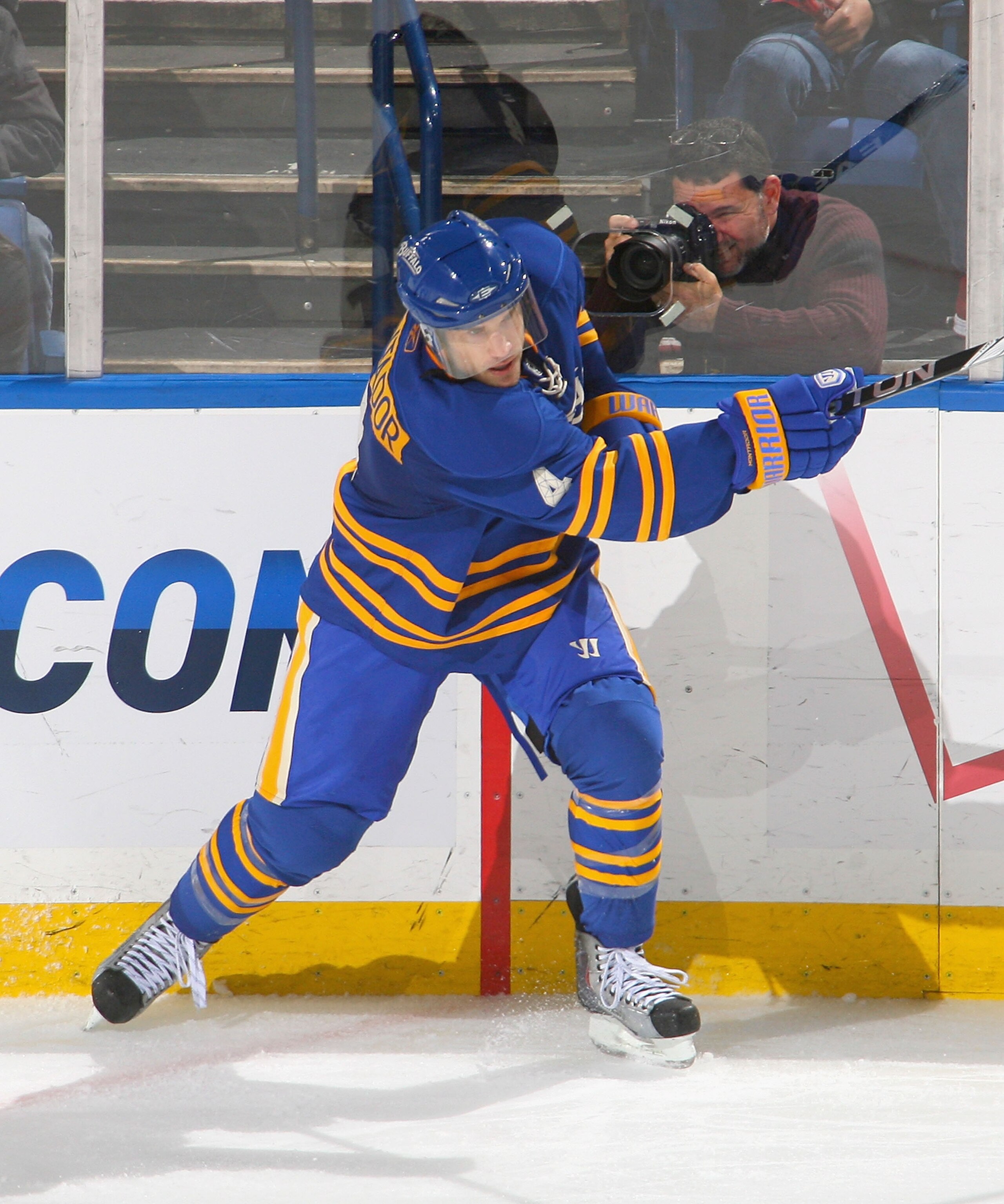 BUFFALO, NY - NOVEMBER 26: Steve Montador #4 of the Buffalo Sabres clears the puck  against the Toronto Maple Leafs at HSBC Arena on November 26, 2010 in Buffalo, New York. Buffalo won 3-1.  (Photo by Rick Stewart/Getty Images)