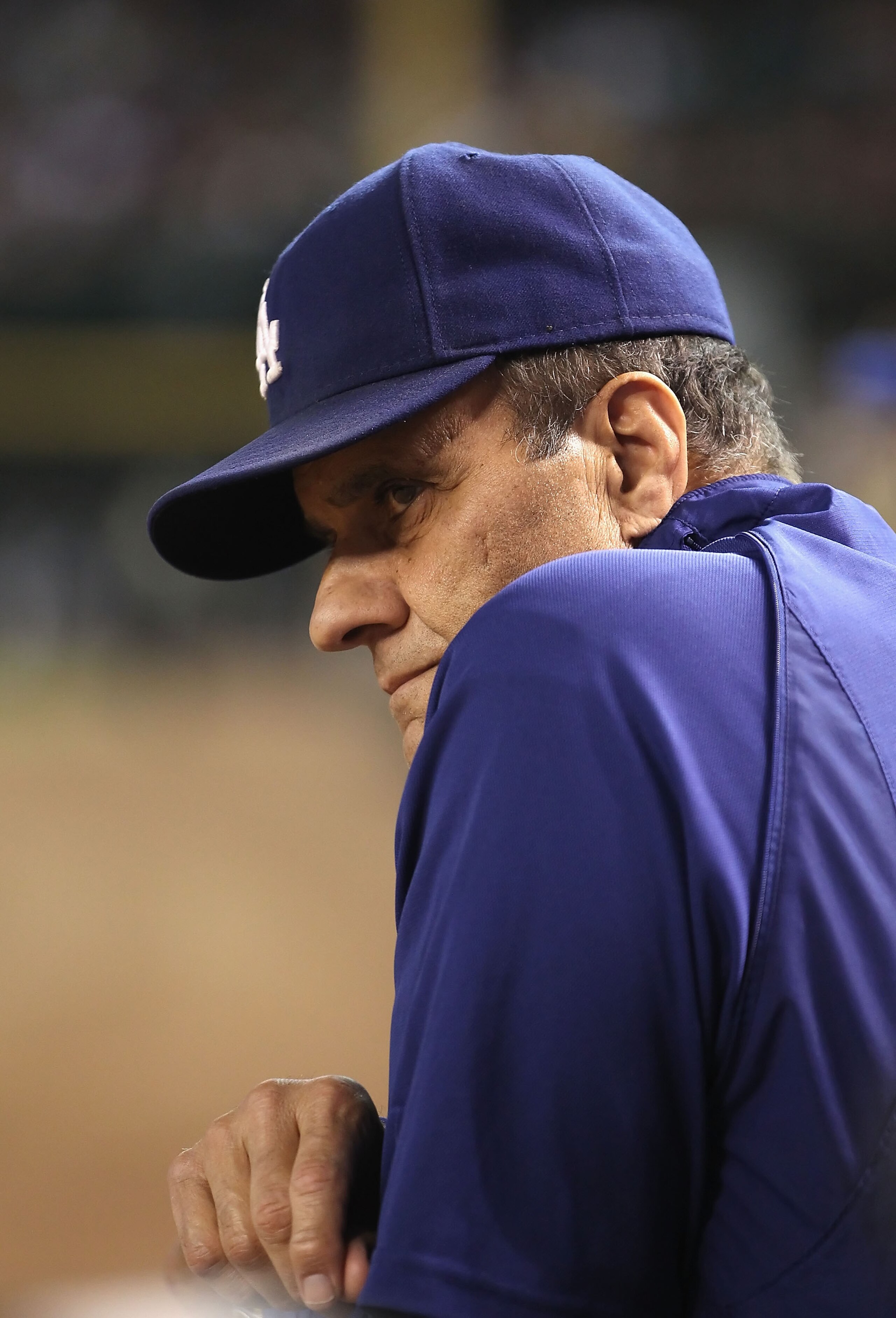 PHOENIX - SEPTEMBER 24:  Manager Joe Torre of the Los Angeles Dodgers watches from the dugout during the Major League Baseball game against the Arizona Diamondbacks at Chase Field on September 24, 2010 in Phoenix, Arizona.  (Photo by Christian Petersen/Ge
