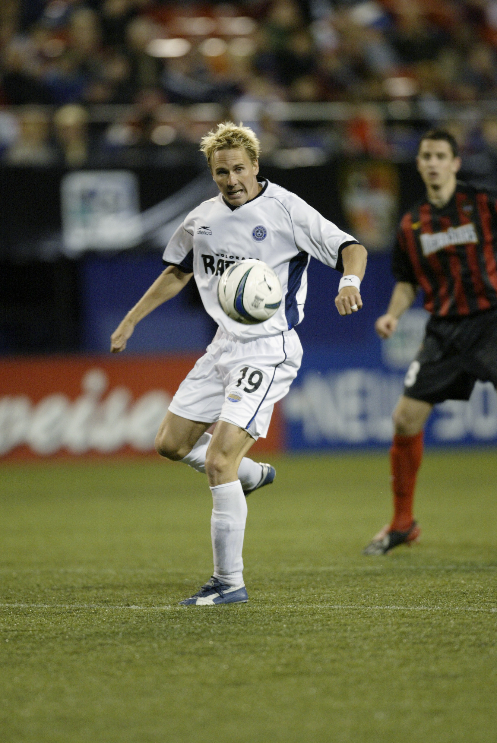 EAST RUTHERFORD, NJ - MAY 3:  Midfielder Chris Henderson #19 of the Colorado Rapids attempts to volley the ball during the MLS game against the New York-New Jersey MetroStars at Giants Stadium on May 3, 2003 in East Rutherford, New Jersey. The MetroStars 