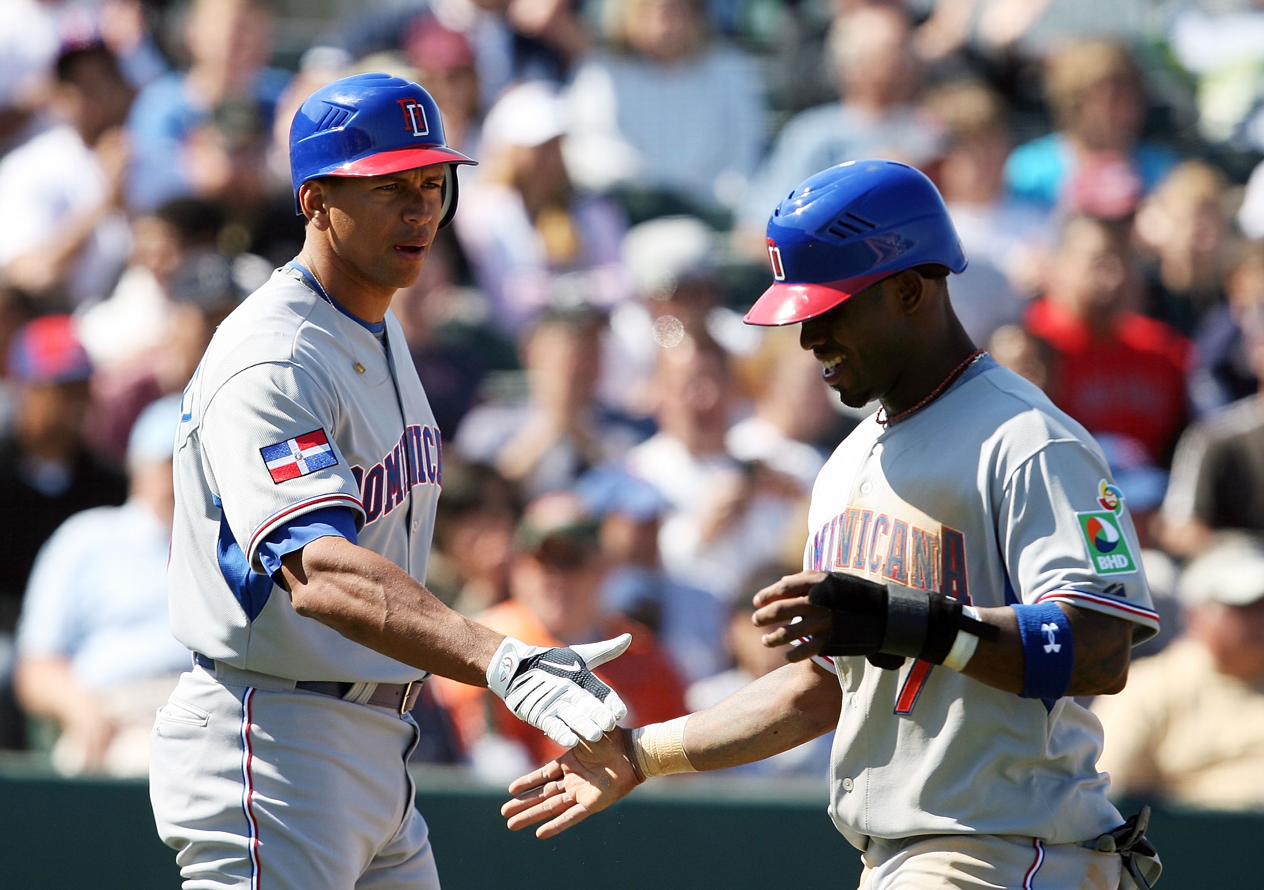 JUPITER, FL - MARCH 3:  Alex Rodriguez #13 of the Dominican Republic congratulates Jose Reyes #7 after Reyes scored against the Florida Marlins during an exhibition game at Roger Dean Stadium March 3, 2009 in Jupiter, Florida.  (Photo by Doug Benc/Getty I