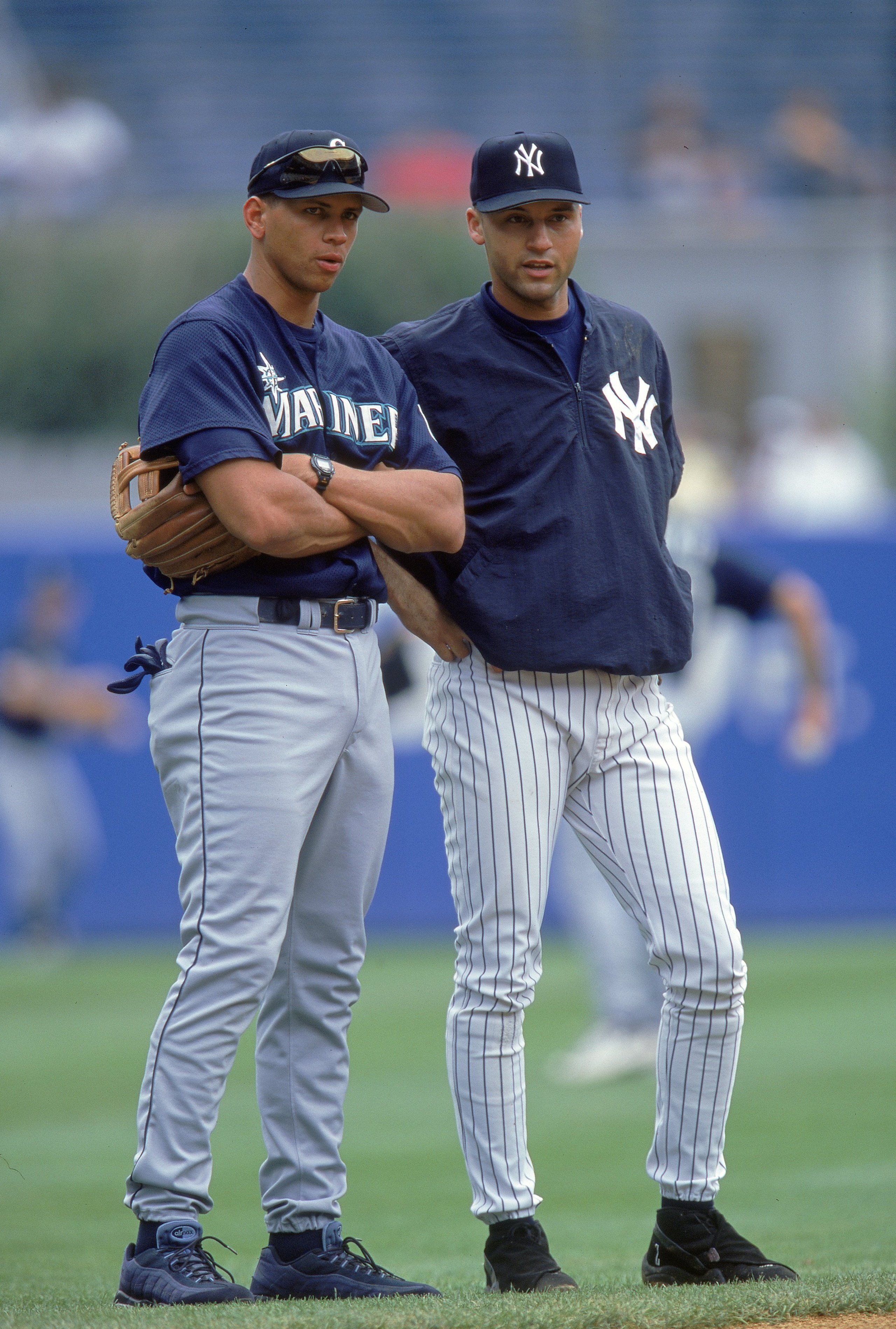 6 Aug 2000:  Derek Jeter #2 of the New York Yankees talks with Alex Rodriguez #3 of the Seattle Mariners during practice before the game at Yankee Stadium in the Bronx, New York. The Mariners defeated the Yankees 11-1.Mandatory Credit: Jamie Squire  /Alls