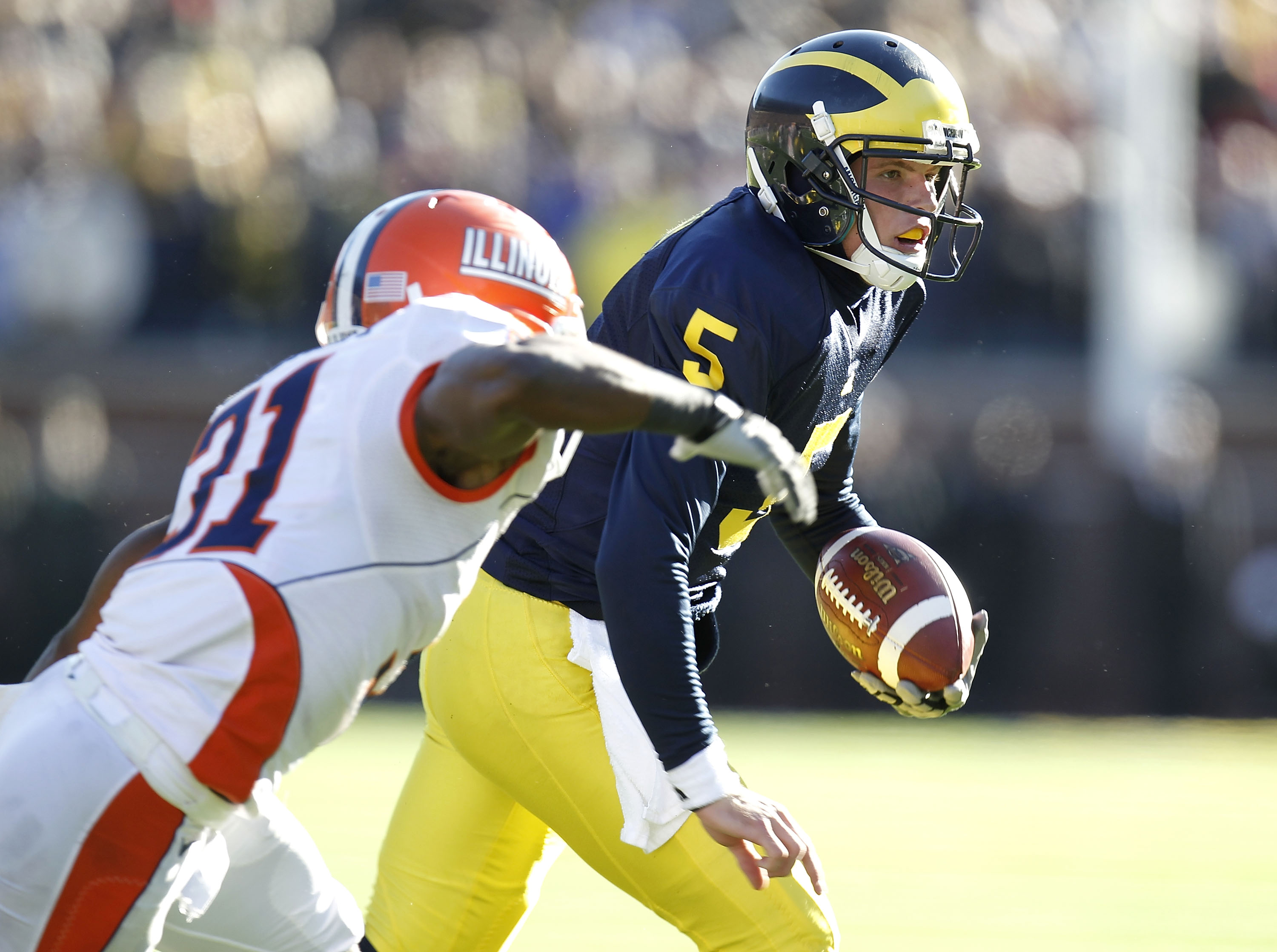 ANN ARBOR, MI - NOVEMBER 06:  Tate Forcier #5 of the Michigan Wolverines runs the ball in overtime while playing the Illinios Fighting Illini at Michigan Stadium on November 6, 2010 in Ann Arbor, Michigan.  (Photo by Gregory Shamus/Getty Images)