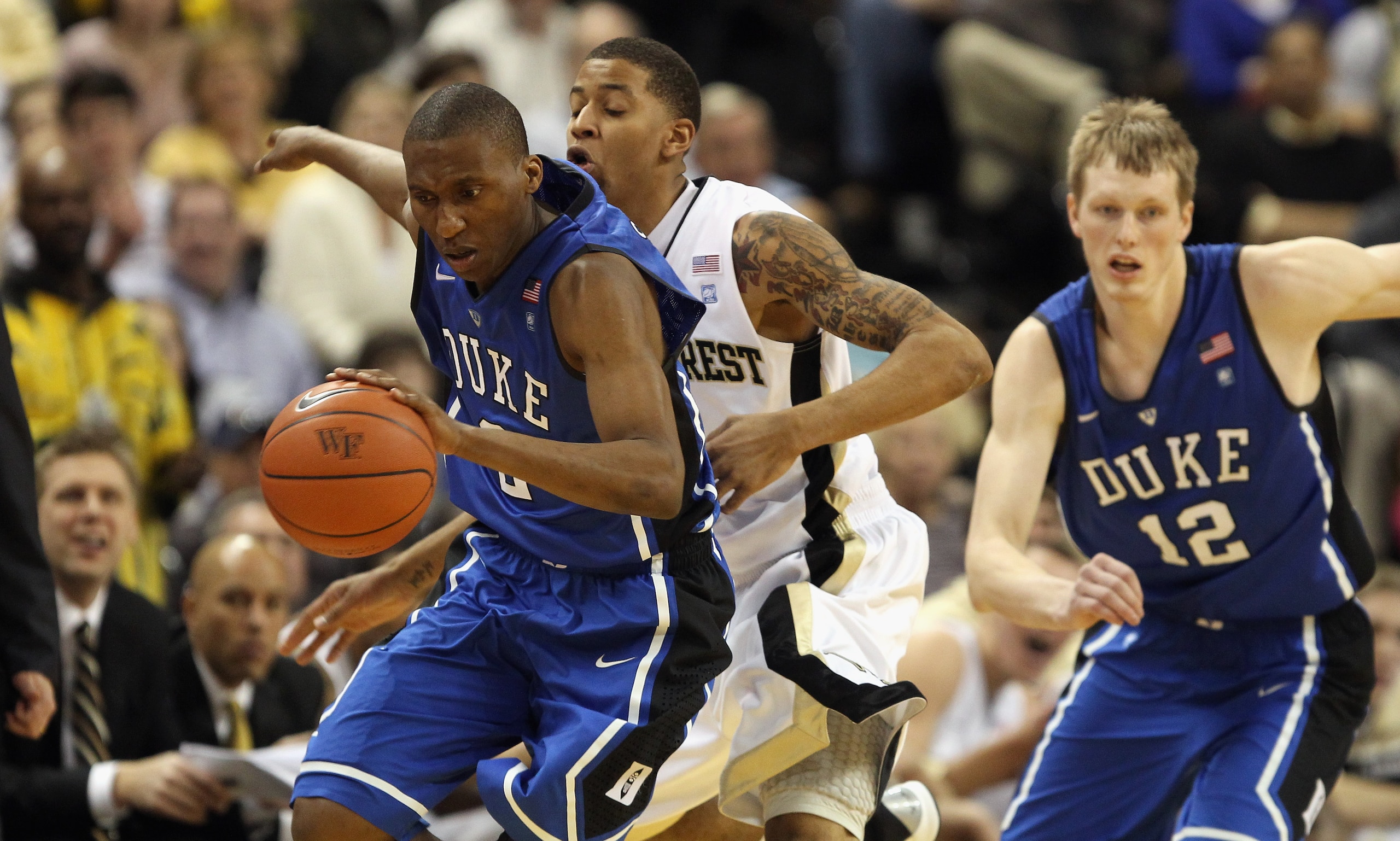 WINSTON SALEM, NC - JANUARY 22: Nolan Smith #2 of the Duke Blue Devils drives to the basket against J.T. Terrell #0 of the Wake Forest Demon Deacons during their game at Lawrence Joel Coliseum on January 22, 2011 in Winston Salem, North Carolina. (Phot WINSTON SALEM, NC - JANUARY 22: Nolan Smith #2 of the Duke Blue Devils drives to the basket against J.T. Terrell #0 of the Wake Forest Demon Deacons during their game at Lawrence Joel Coliseum on January 22, 2011 in Winston Salem, North Carolina. (Phot