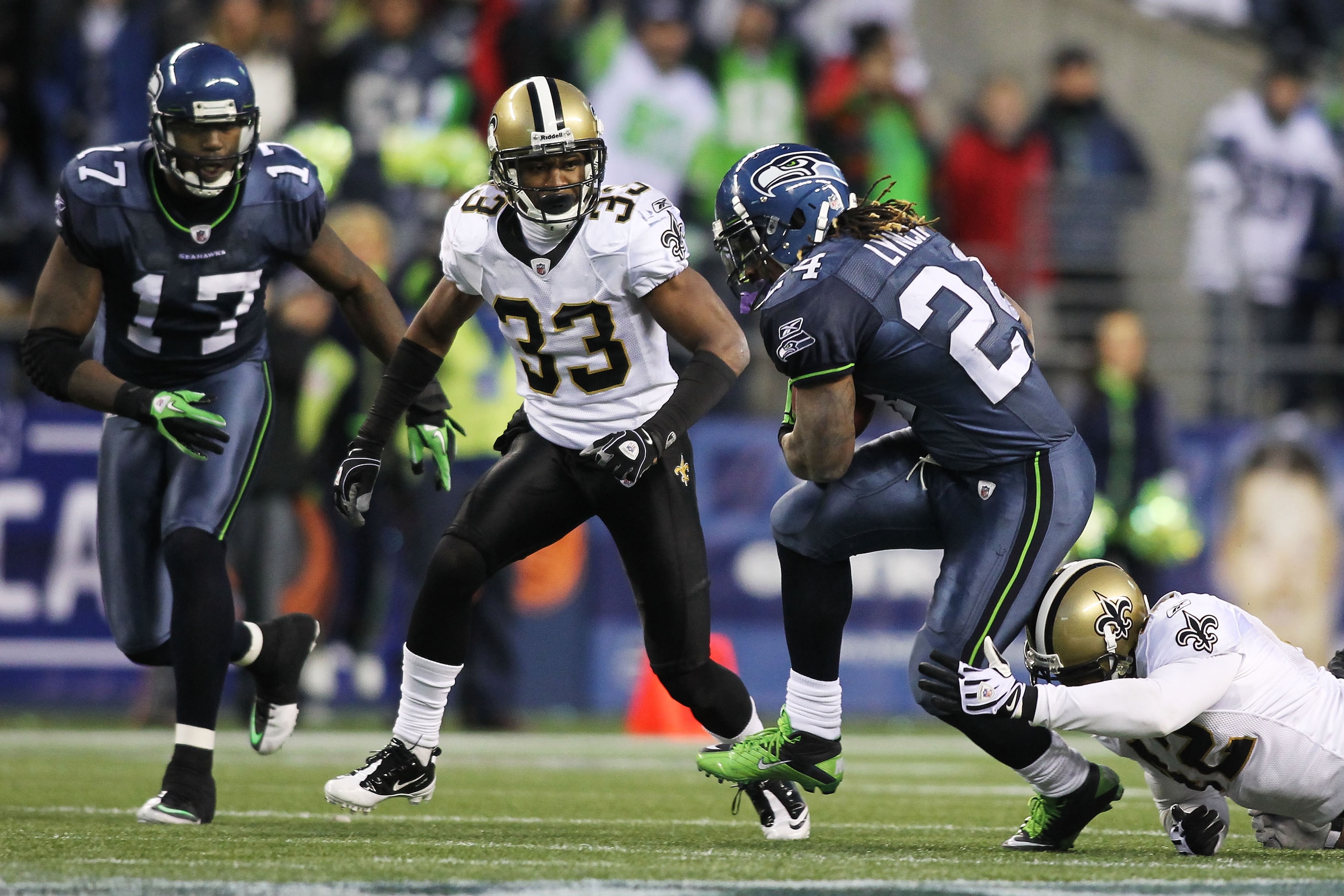 SEATTLE, WA - JANUARY 08:  Running back Marshawn Lynch #24 of the Seattle Seahawks runs for a 67-yard touchdown in the fourth quarter against the New Orleans Saints during the 2011 NFC wild-card playoff game at Qwest Field on January 8, 2011 in Seattle, W