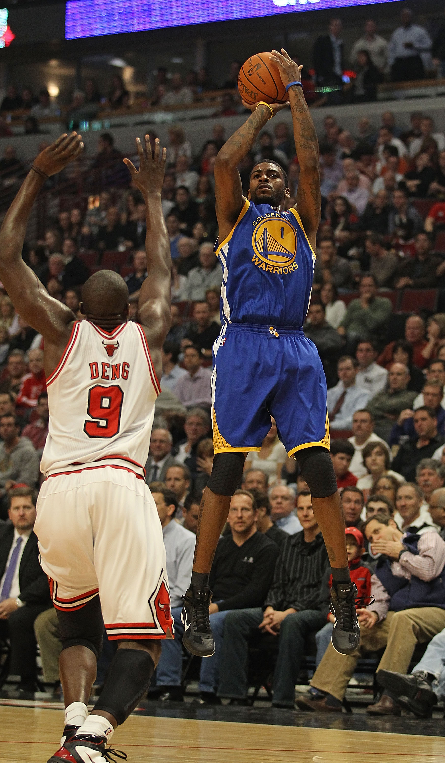 CHICAGO, IL - NOVEMBER 11: Dorell Wright #1 of the Golden State Warriors puts up a shot over Loul Deng #9 of the Chicago Bulls at the United Center on November 11, 2010 in Chicago, Illinois. The Bulls defeated the Warriors 120-90. NOTE TO USER: User expre
