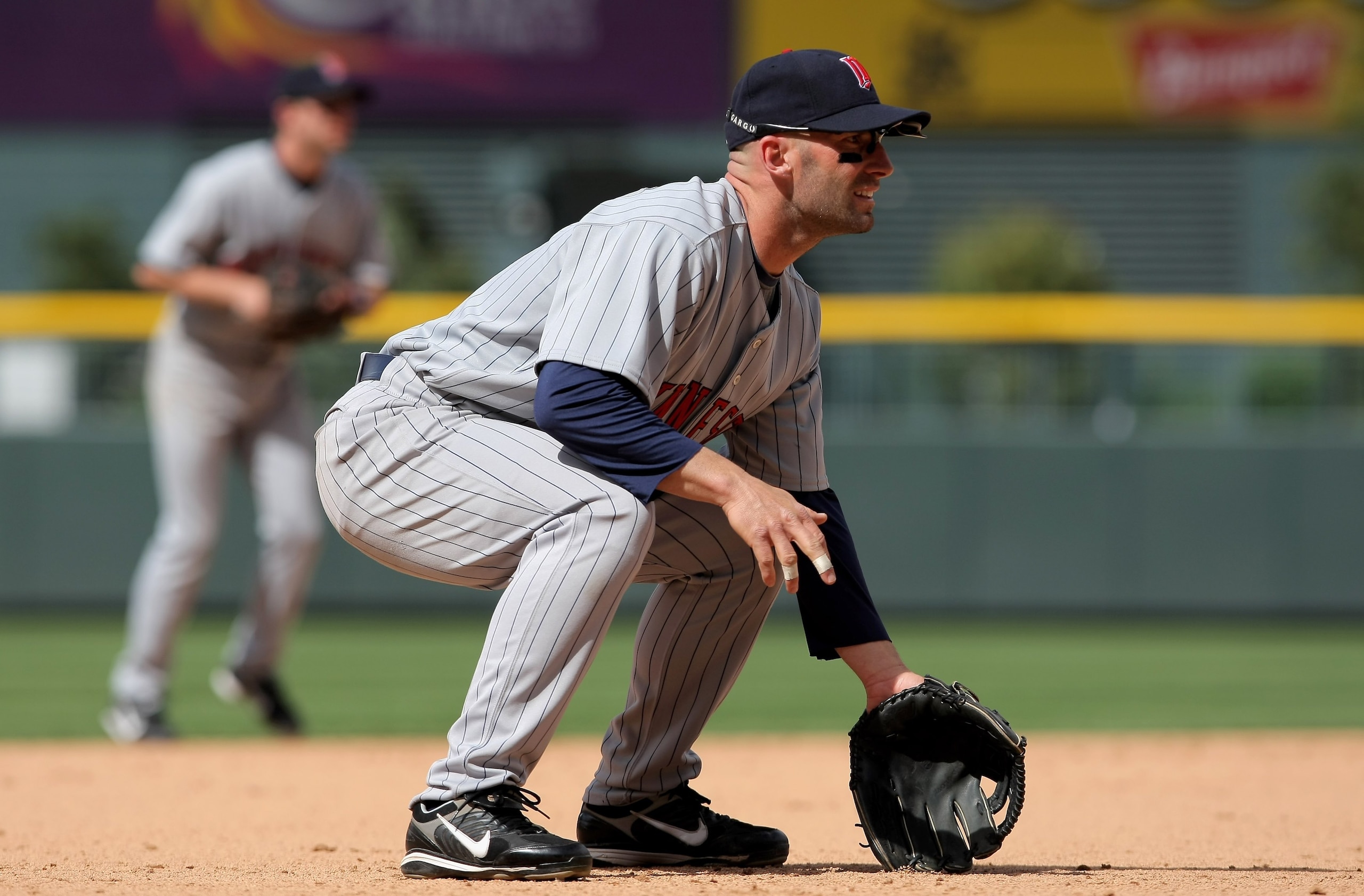 DENVER - MAY 18:  Third baseman Howie Clark #19 of the Minnesota Twins plays defense against the Colorado Rockies during Interleague MLB action at Coors Field on May 18, 2008 in Denver, Colorado. The Rockies defeated the Twins 6-2.  (Photo by Doug Pensing