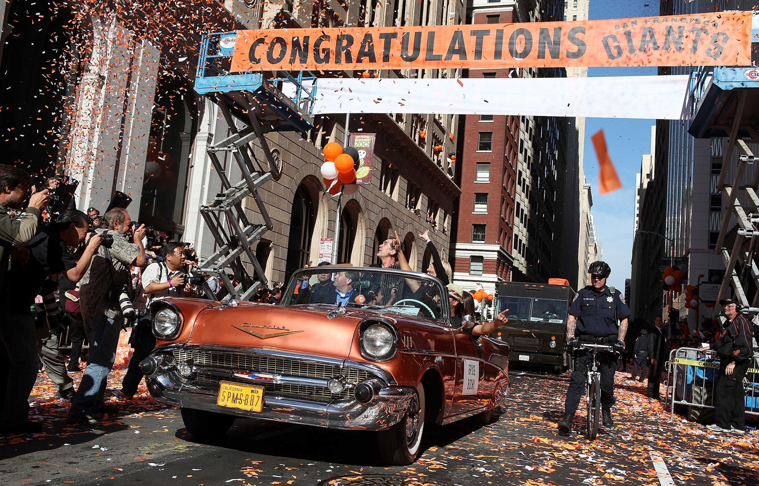 SAN FRANCISCO - NOVEMBER 03: San Francisco Giants manager Bruce Bochy rides in a vintage car during the Giants' vicotry parade on November 3, 2010 in San Francisco, California. Thousands of Giants fans lined the streets of San Francisco to watch the San SAN FRANCISCO - NOVEMBER 03: San Francisco Giants manager Bruce Bochy rides in a vintage car during the Giants' vicotry parade on November 3, 2010 in San Francisco, California. Thousands of Giants fans lined the streets of San Francisco to watch the San