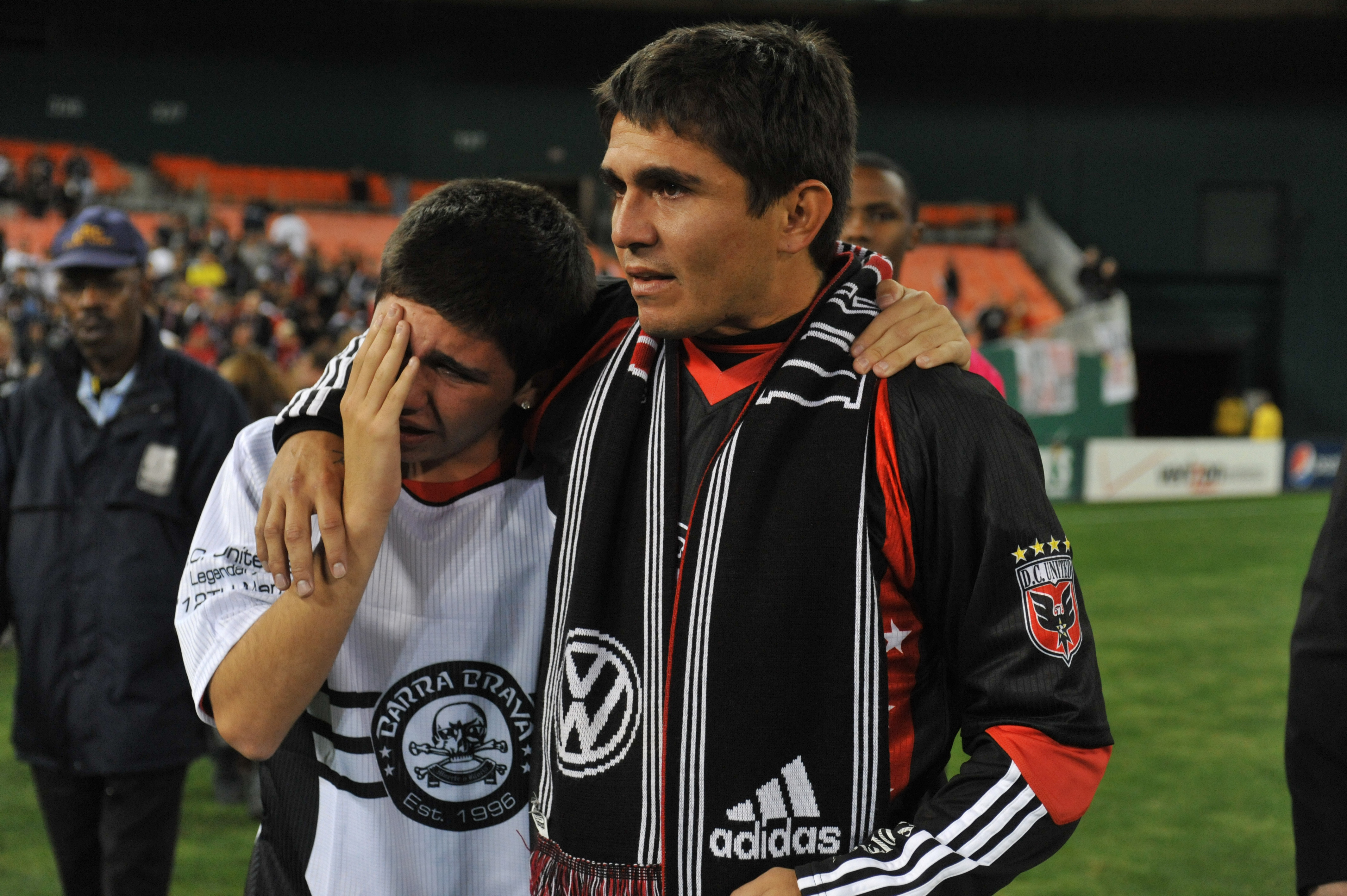 WASHINGTON, DC - OCTOBER 23:  Jaime Moreno #99 of D.C. United walks off the field with his son, James, after the game against Toronto FC at RFK Stadium on October 23, 2010 in Washington, DC. Toronto defeated DC 3-2. (Photo by Larry French/Getty Images)
