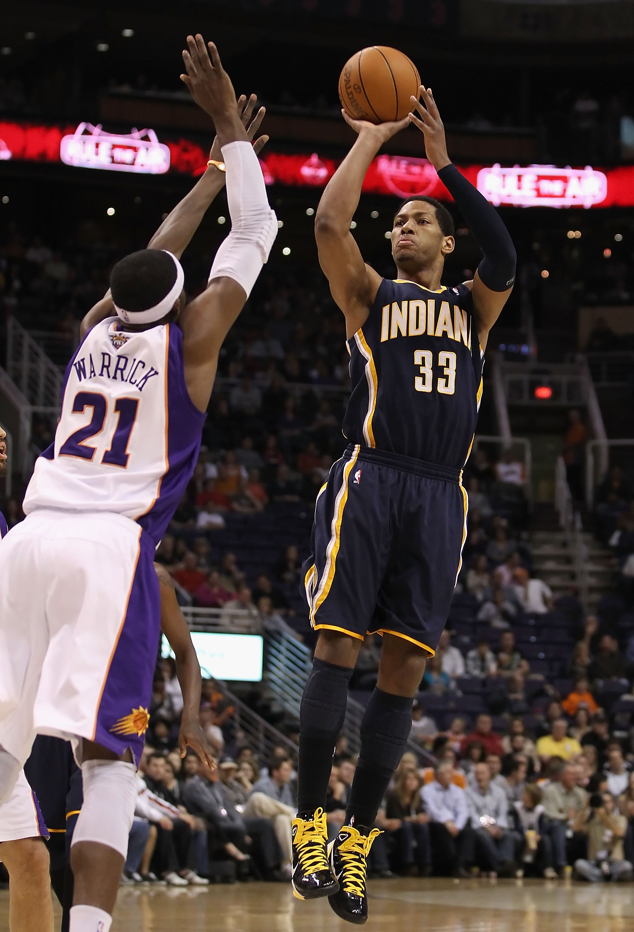 PHOENIX - DECEMBER 03:  Danny Granger #33 of the Indiana Pacers puts up a shot over Hakim Warrick #21 of the Phoenix Suns during the NBA game at US Airways Center on December 3, 2010 in Phoenix, Arizona.  The Suns defeated the Pacers 107-97.  NOTE TO USER