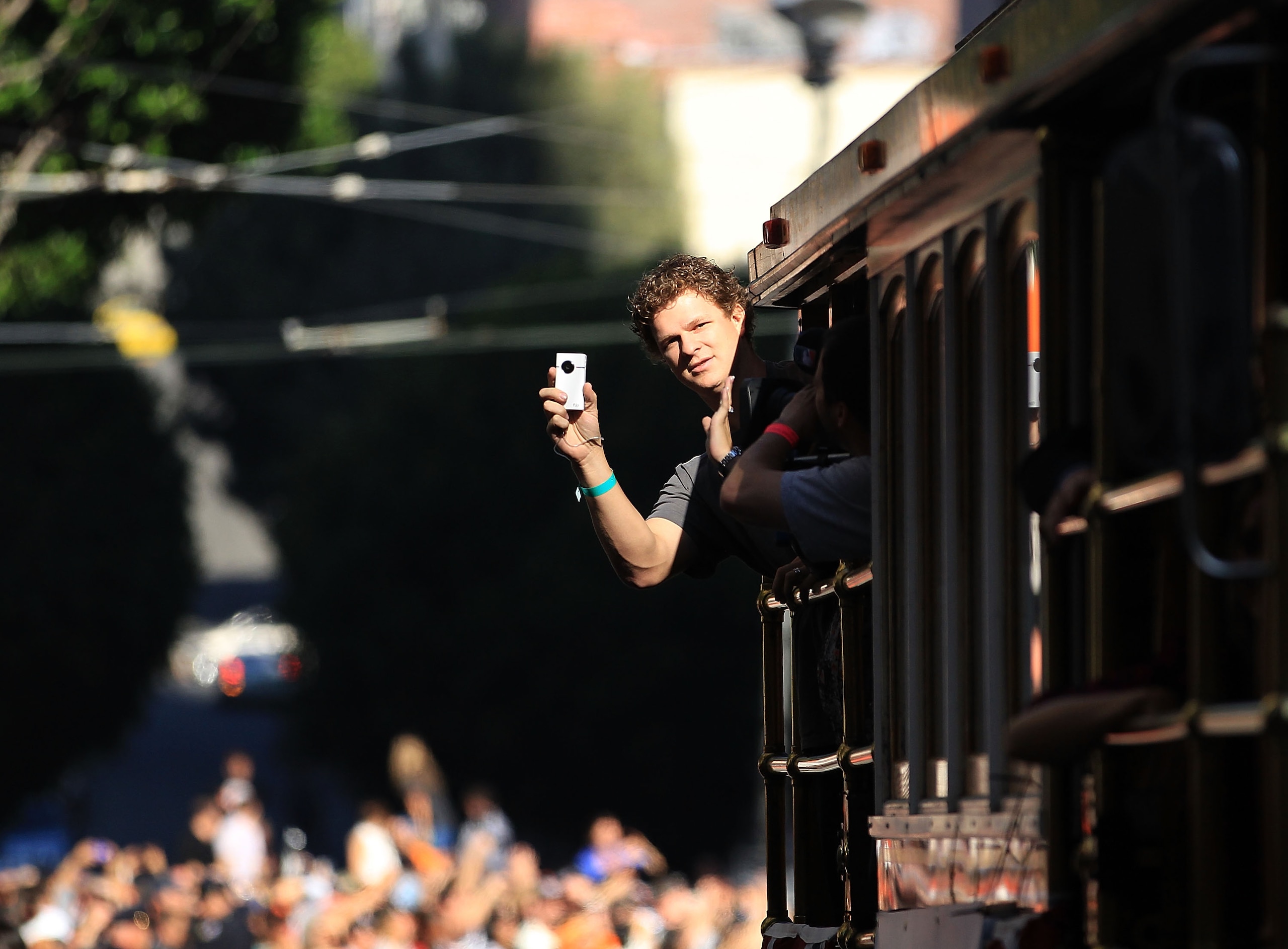 SAN FRANCISCO - NOVEMBER 03: Matt Cain of the San Francisco Giants takes video of the crowd during the San Francisco Giants victory parade on November 3, 2010 in San Francisco, California. (Photo by Ezra Shaw/Getty Images) SAN FRANCISCO - NOVEMBER 03: Matt Cain of the San Francisco Giants takes video of the crowd during the San Francisco Giants victory parade on November 3, 2010 in San Francisco, California. (Photo by Ezra Shaw/Getty Images)