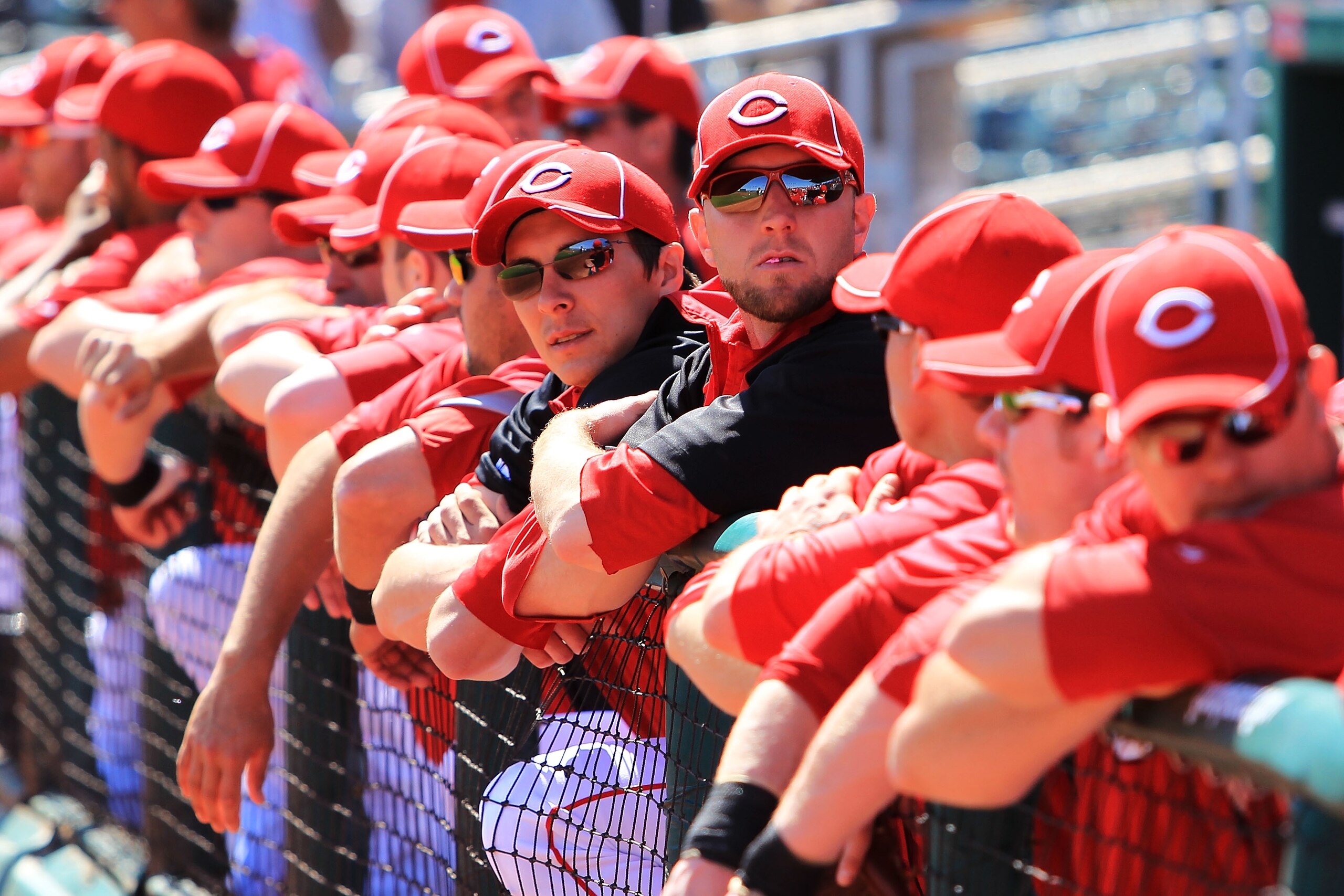 GOODYEAR, AZ - MARCH 05: Cincinnati Reds players wait in the dugout for play to begin against the Cleveland Indians during a spring training game at Goodyear Ballpark on March 5, 2010 in Goodyear, Arizona.  (Photo by Chris McGrath/Getty Images)
