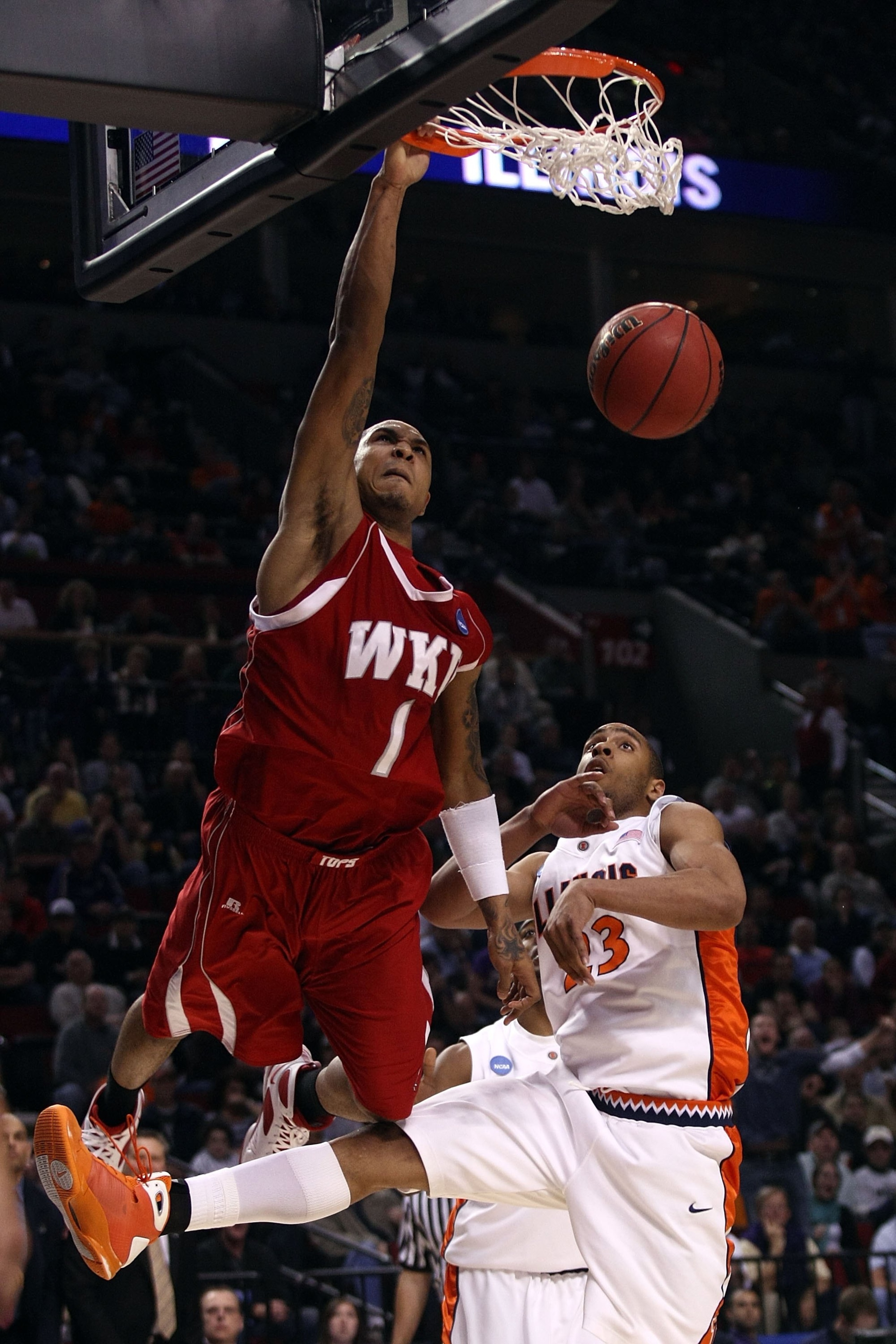 PORTLAND, OR - MARCH 19: Sergio Kerusch #1 of the Western Kentucky Hilltoppers dunks the ball over Dominique Keller #23 of the Illinois Fighting Illini in the second half during the first round of the NCAA Division I Men's Basketball Tournament at the Ro PORTLAND, OR - MARCH 19: Sergio Kerusch #1 of the Western Kentucky Hilltoppers dunks the ball over Dominique Keller #23 of the Illinois Fighting Illini in the second half during the first round of the NCAA Division I Men's Basketball Tournament at the Ro