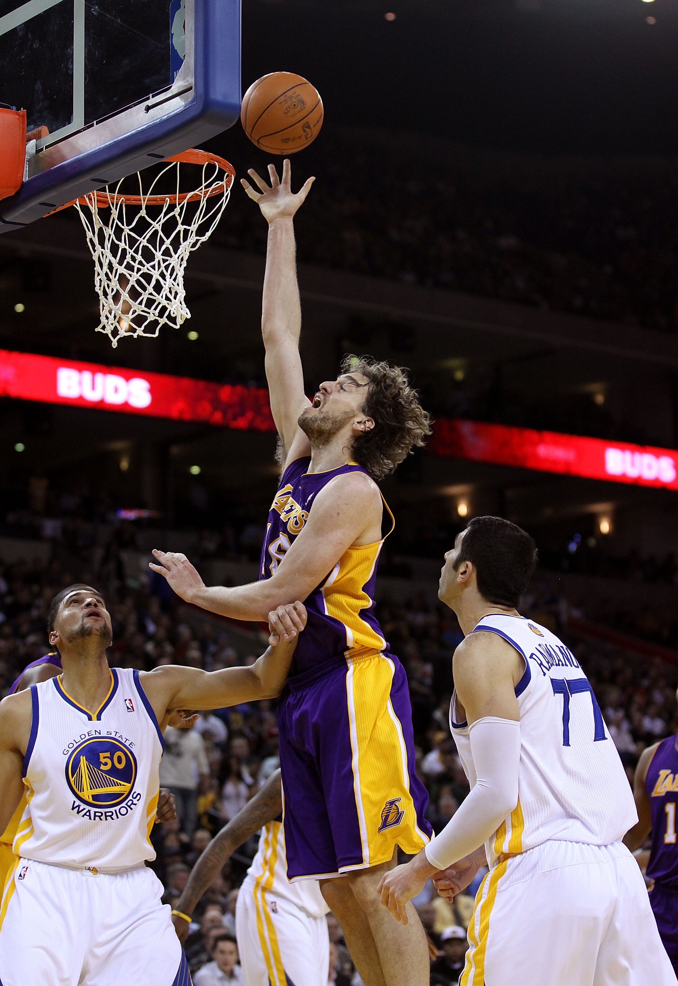 OAKLAND, CA - JANUARY 12: Pau Gasol #16 of the Los Angeles Lakers shoots over Dan Gadzuric #50 of the Golden State Warriors at Oracle Arena on January 12, 2011 in Oakland, California. NOTE TO USER: User expressly acknowledges and agrees that, by downloadi