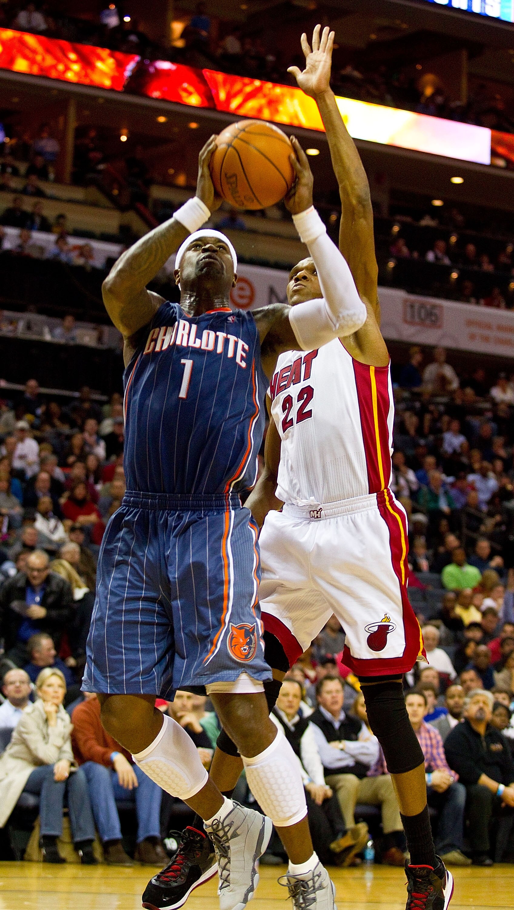 CHARLOTTE, NC - FEBRUARY 04:  Stephen Jackson #1 of the Charlotte Bobcats drives to the basket past James Jones #22 of the Miami Heat at the Time Warner Cable Arena on February 4, 2011 in Charlotte, North Carolina.  The Heat defeated the Bobcats 109-97.  