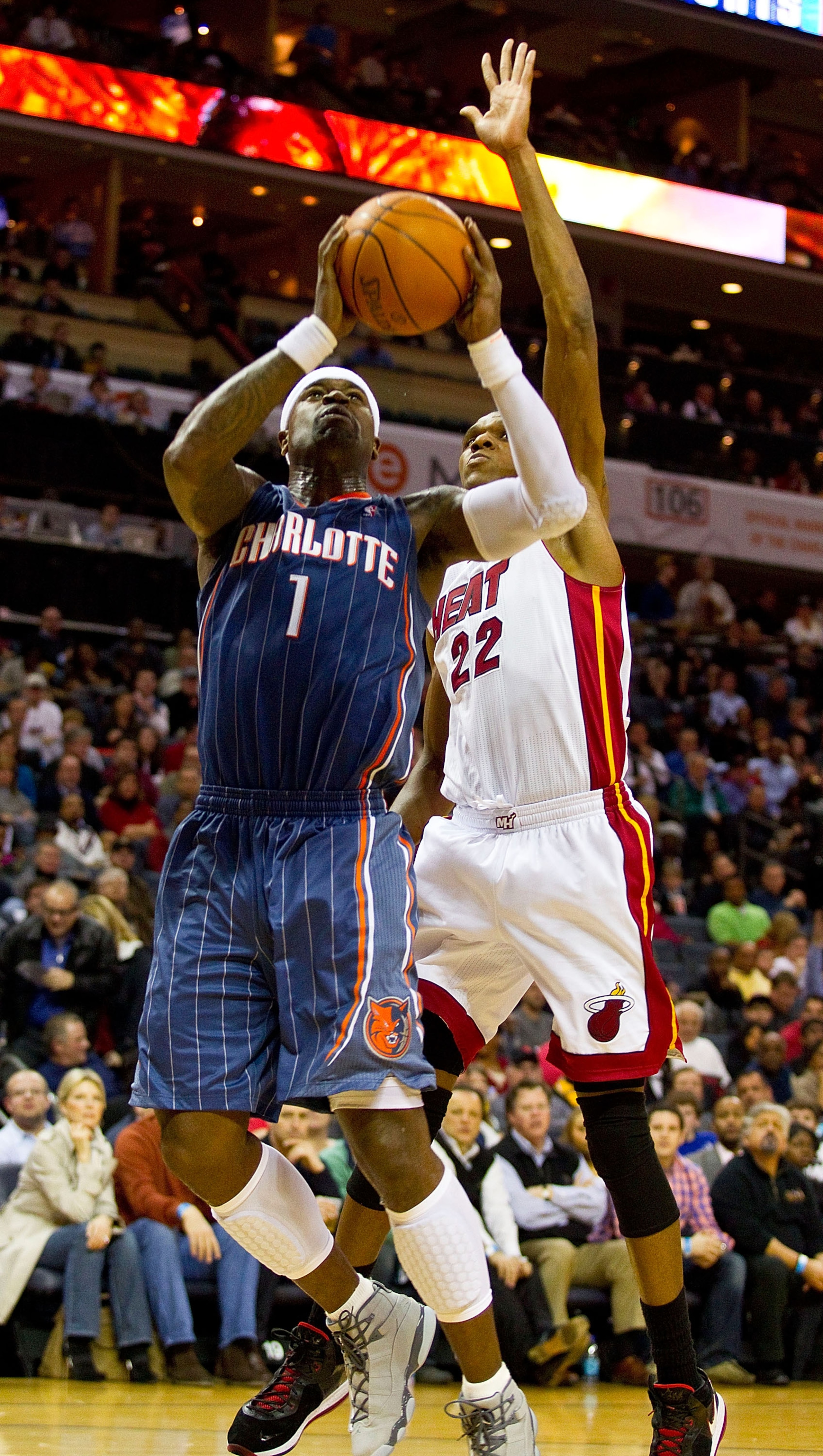 CHARLOTTE, NC - FEBRUARY 04:  Stephen Jackson #1 of the Charlotte Bobcats drives to the basket past James Jones #22 of the Miami Heat at the Time Warner Cable Arena on February 4, 2011 in Charlotte, North Carolina.  The Heat defeated the Bobcats 109-97.  