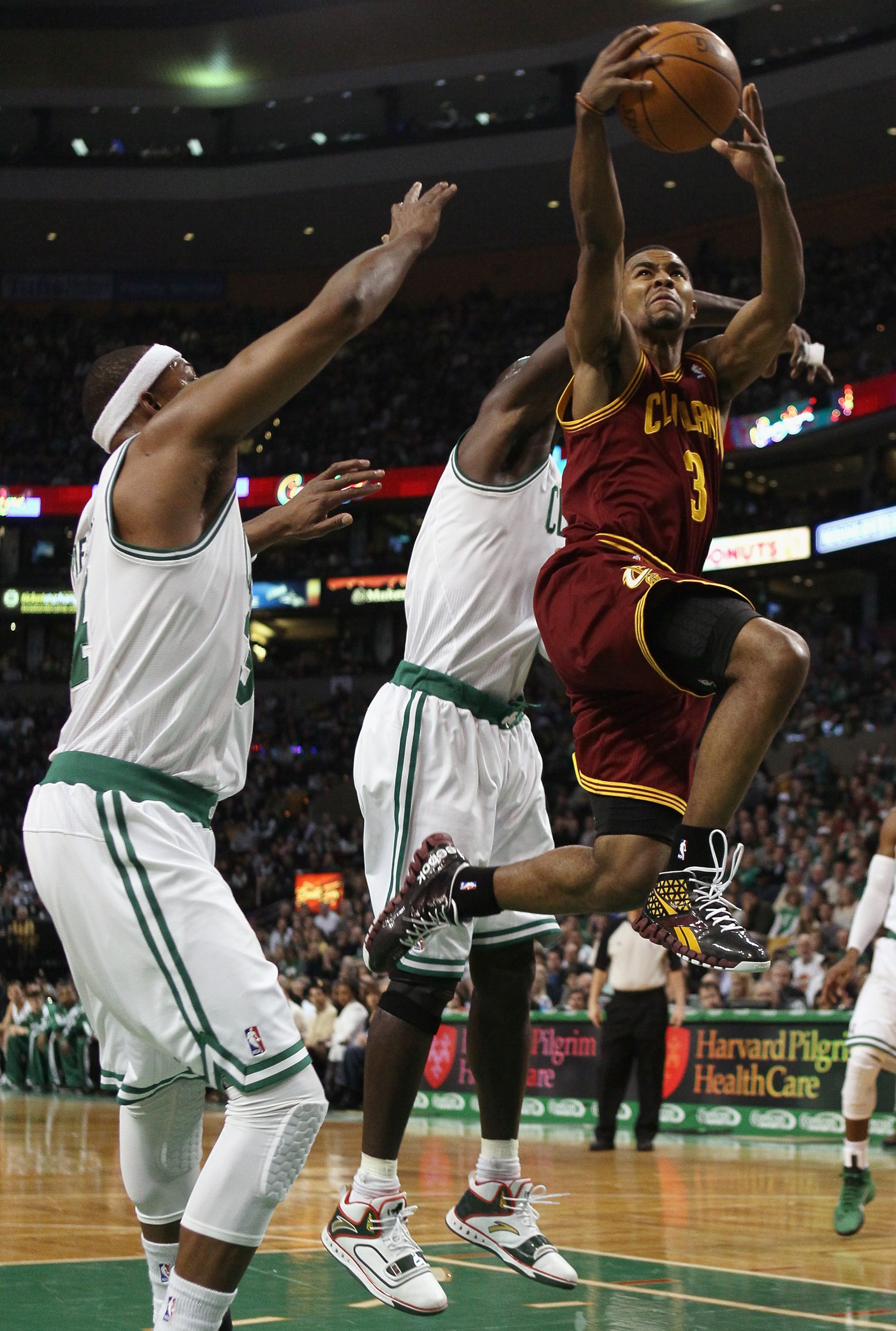 BOSTON, MA - JANUARY 25:  Ramon Sessions #3 of the of the Cleveland Cavaliers takes a shot as Paul Pierce #34 and Kevin Garnett #5 of the Boston Celtics defend on January 25, 2011 at the TD Garden in Boston, Massachusetts.   NOTE TO USER: User expressly a