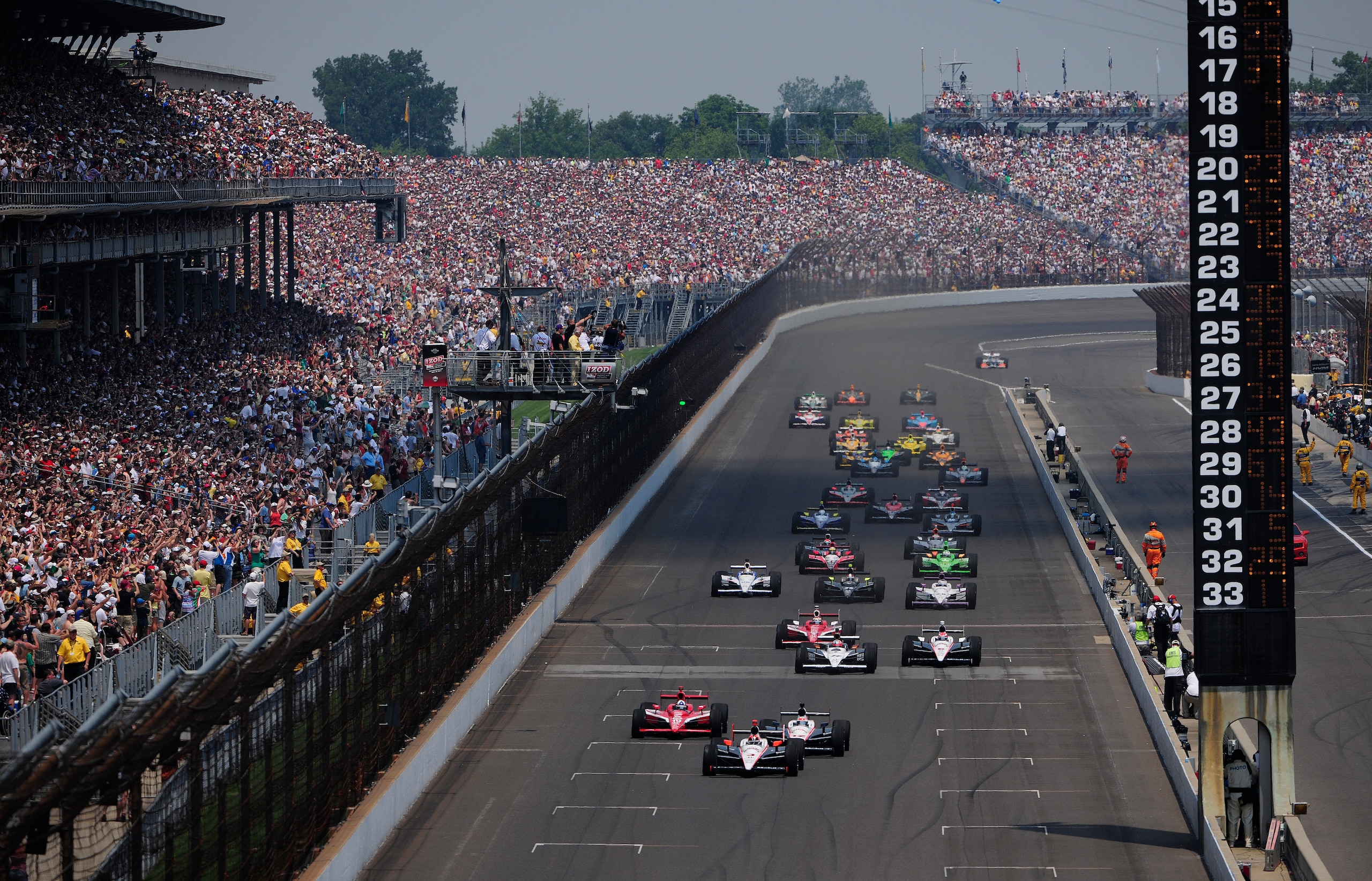 INDIANAPOLIS - MAY 30:  Helio Castroneves of Brazil, driver of the #3 Team Penske Dallara Honda, leads the field at the start of the IZOD IndyCar Series 94th running of the Indianapolis 500 at the Indianapolis Motor Speedway on May 30, 2010 in Indianapoli