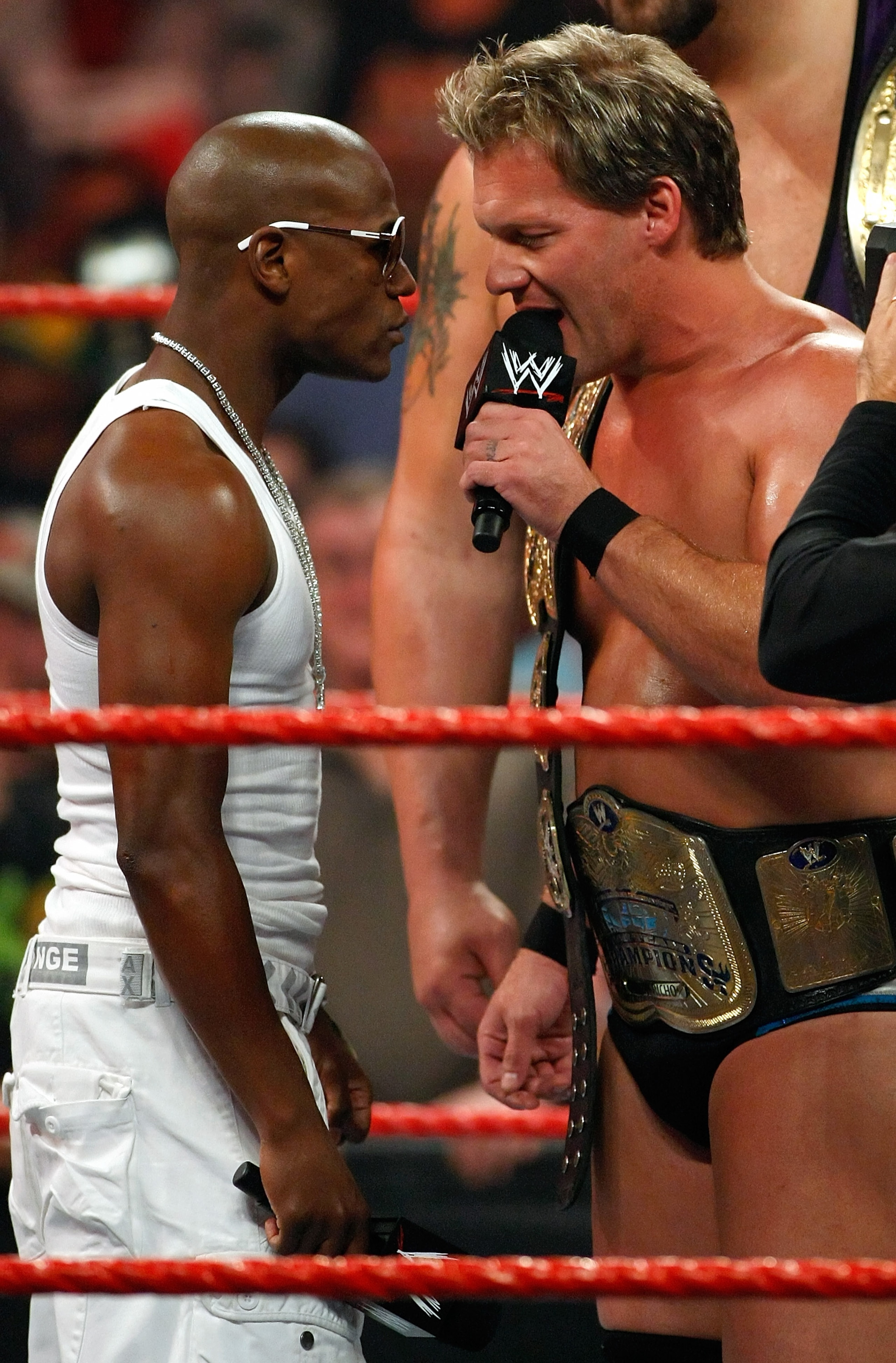 LAS VEGAS - AUGUST 24:  Boxer Floyd Mayweather Jr. (L) stares down wrestler Chris Jericho during the WWE Monday Night Raw show at the Thomas & Mack Center August 24, 2009 in Las Vegas, Nevada. Mayweather was a special guest host during the broadcast.  (Ph
