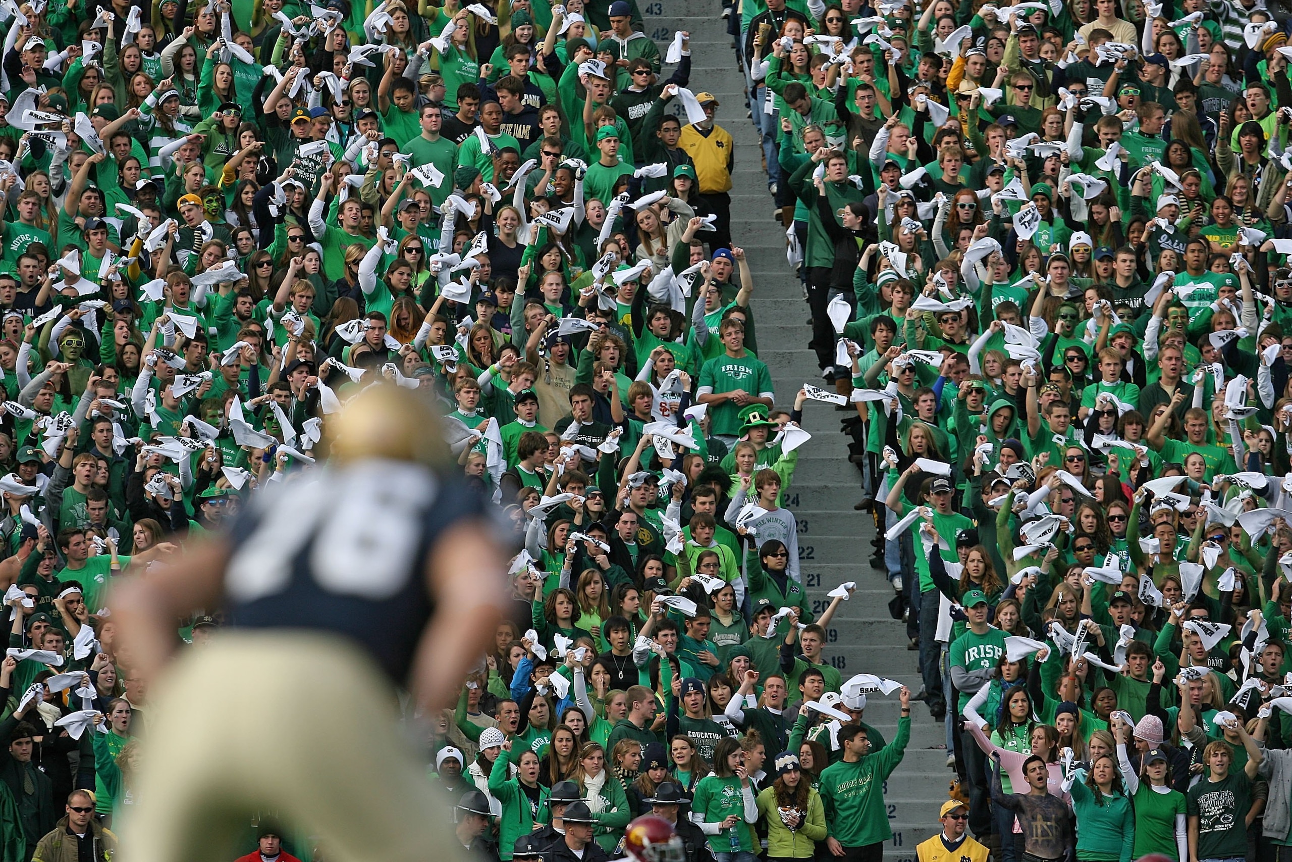 SOUTH BEND, IN - OCTOBER 17: Student fans of the Notre Dame Fighting Irish wave towels before a kick-off against the USC Trojans at Notre Dame Stadium on October 17, 2009 in South Bend, Indiana. USC defeated Notre Dame 34-27. (Photo by Jonathan Daniel/Get