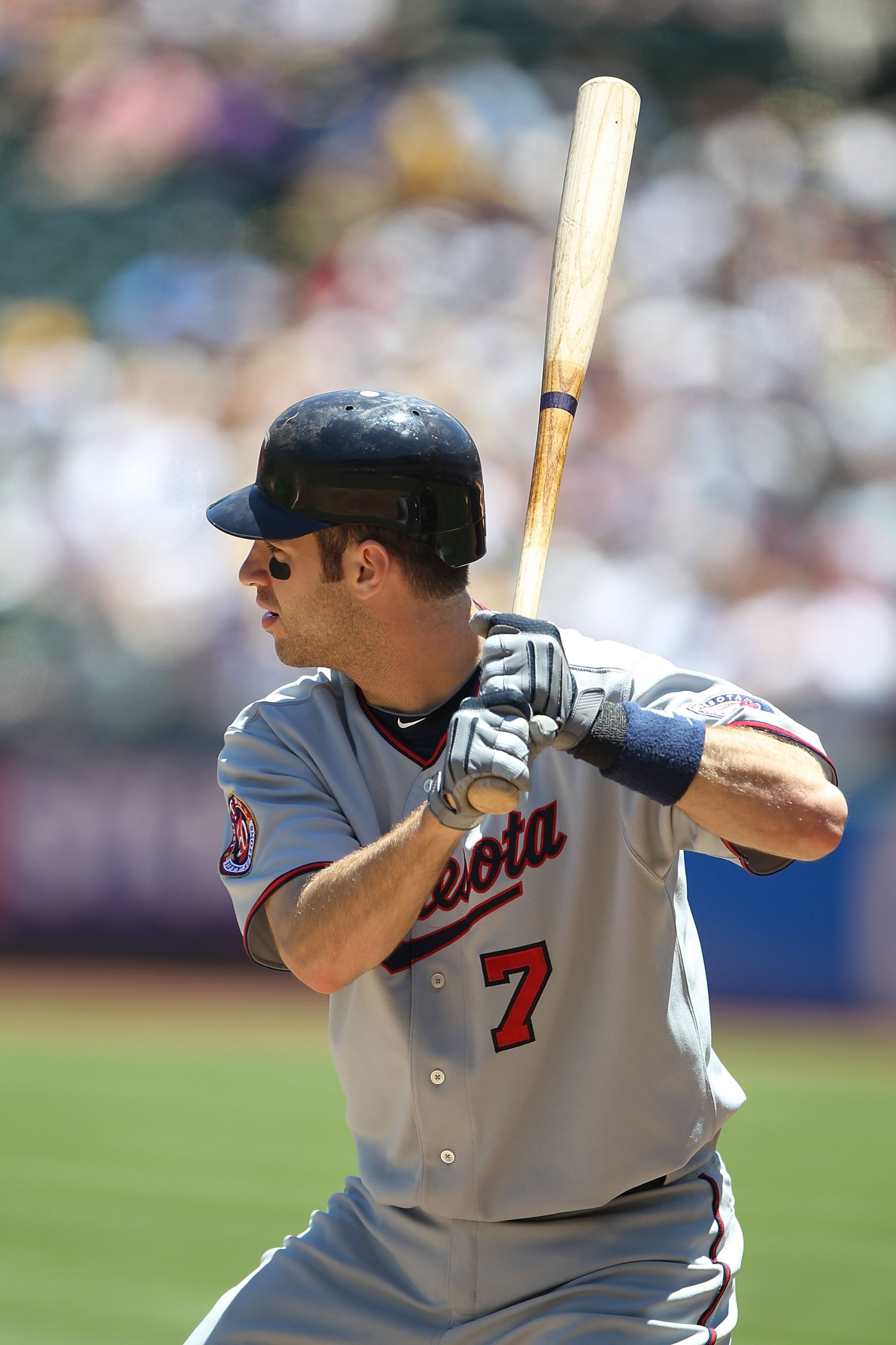 OAKLAND, CA - JUNE 06:  Joe Mauer #7 of the Minnesota Twins bats against the Oakland Athletics during an MLB game at the Oakland-Alameda County Coliseum on June 6, 2010 in Oakland, California.  (Photo by Jed Jacobsohn/Getty Images)