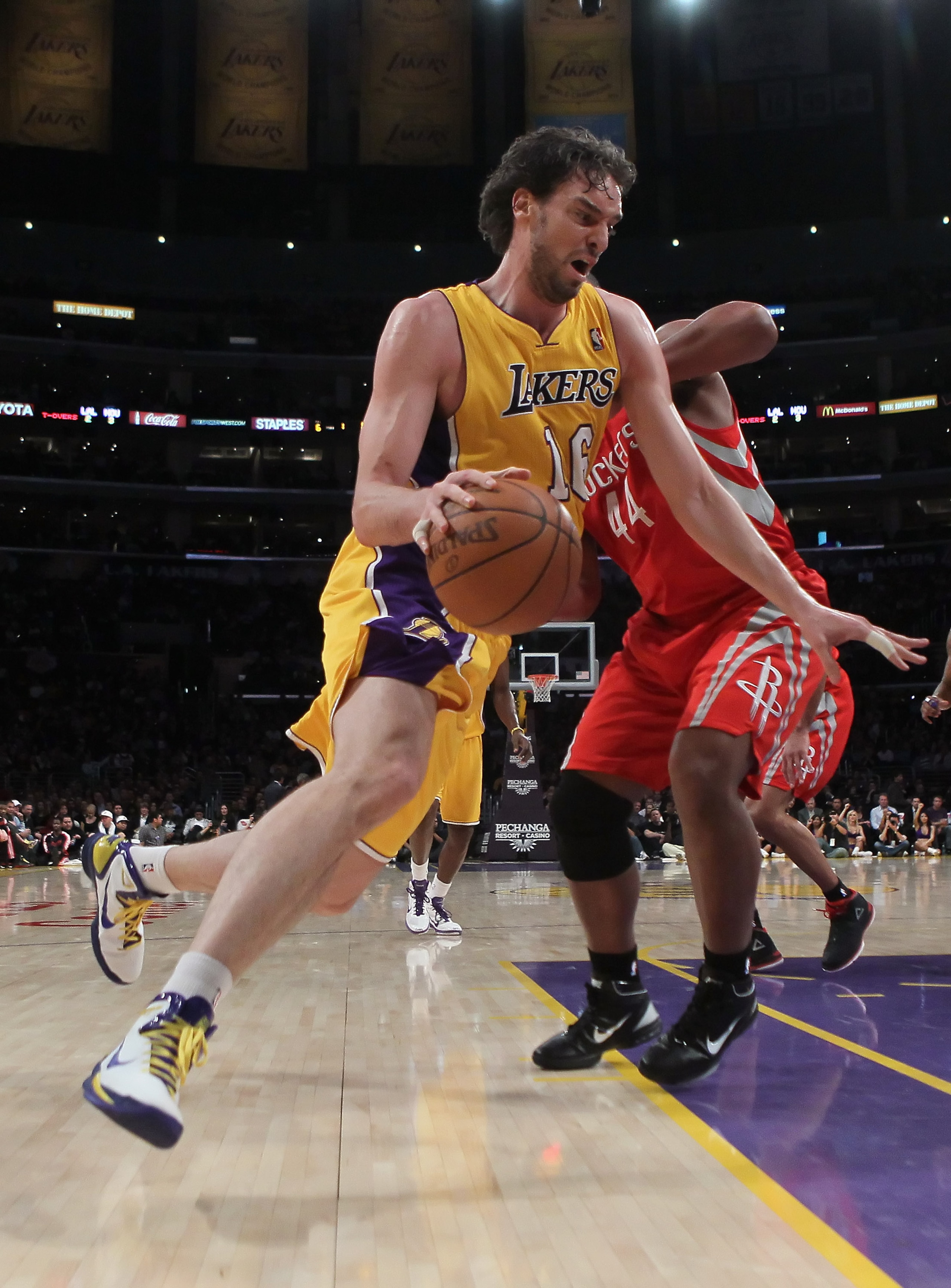 LOS ANGELES, CA - FEBRUARY 01:  Pau Gasol #16 of the Los Angeles Lakers drives around Chuck Hayes #44 of the Houston Rockets in the first half at Staples Center on February 1, 2011 in Los Angeles, California. The Lakers defeated the Rockets 114-106. NOTE 