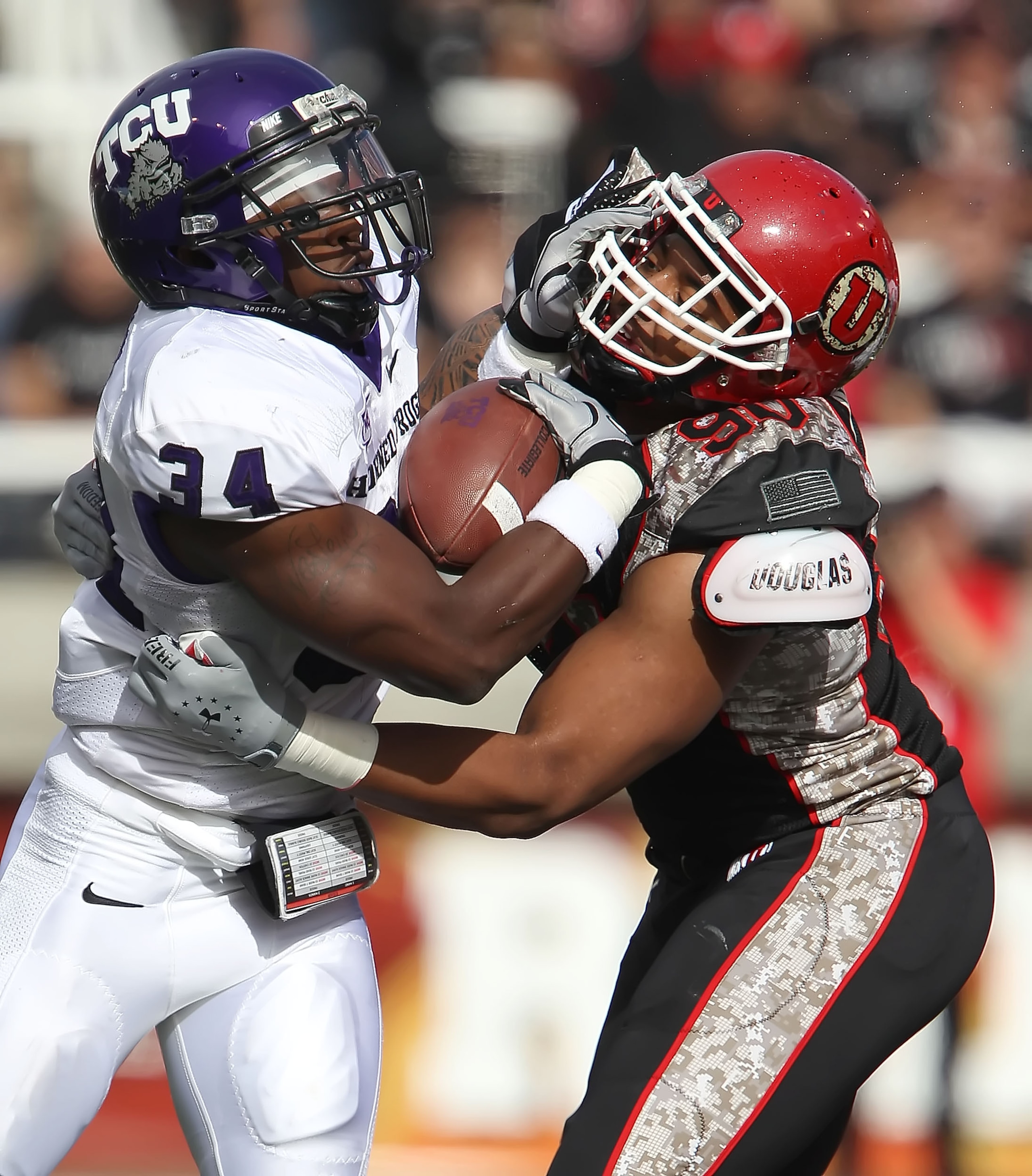 SALT LAKE CITY, UT - NOVEMBER 6: Derrick Shelby #90 of the Utah Utes hits Ed Wesley #34 of the TCU Horned Frogs during the first half of an NCAA football game November 6, 2010 at Rice-Eccles Stadium in Salt Lake City, Utah. (Photo by George Frey/Getty Ima SALT LAKE CITY, UT - NOVEMBER 6: Derrick Shelby #90 of the Utah Utes hits Ed Wesley #34 of the TCU Horned Frogs during the first half of an NCAA football game November 6, 2010 at Rice-Eccles Stadium in Salt Lake City, Utah. (Photo by George Frey/Getty Ima