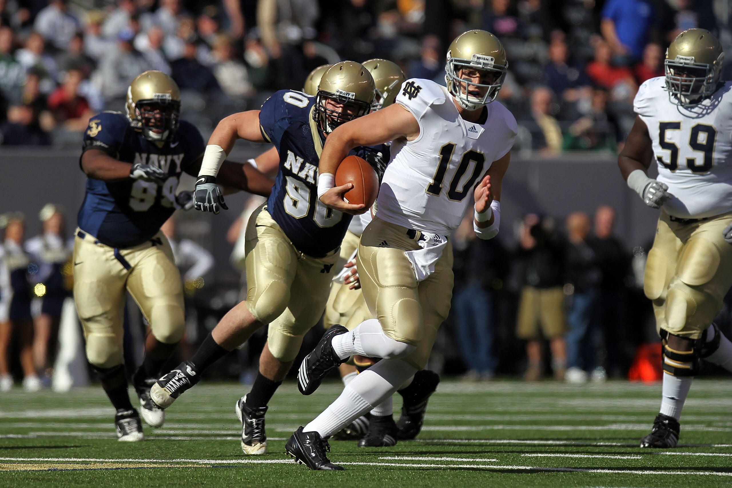 EAST RUTHERFORD, NJ - OCTOBER 23: Dayne Crist #10 of the Notre Dame Fighting Irish rushes against the Navy Midshipmen at New Meadowlands Stadium on October 23, 2010 in East Rutherford, New Jersey. (Photo by Nick Laham/Getty Images) EAST RUTHERFORD, NJ - OCTOBER 23: Dayne Crist #10 of the Notre Dame Fighting Irish rushes against the Navy Midshipmen at New Meadowlands Stadium on October 23, 2010 in East Rutherford, New Jersey. (Photo by Nick Laham/Getty Images)