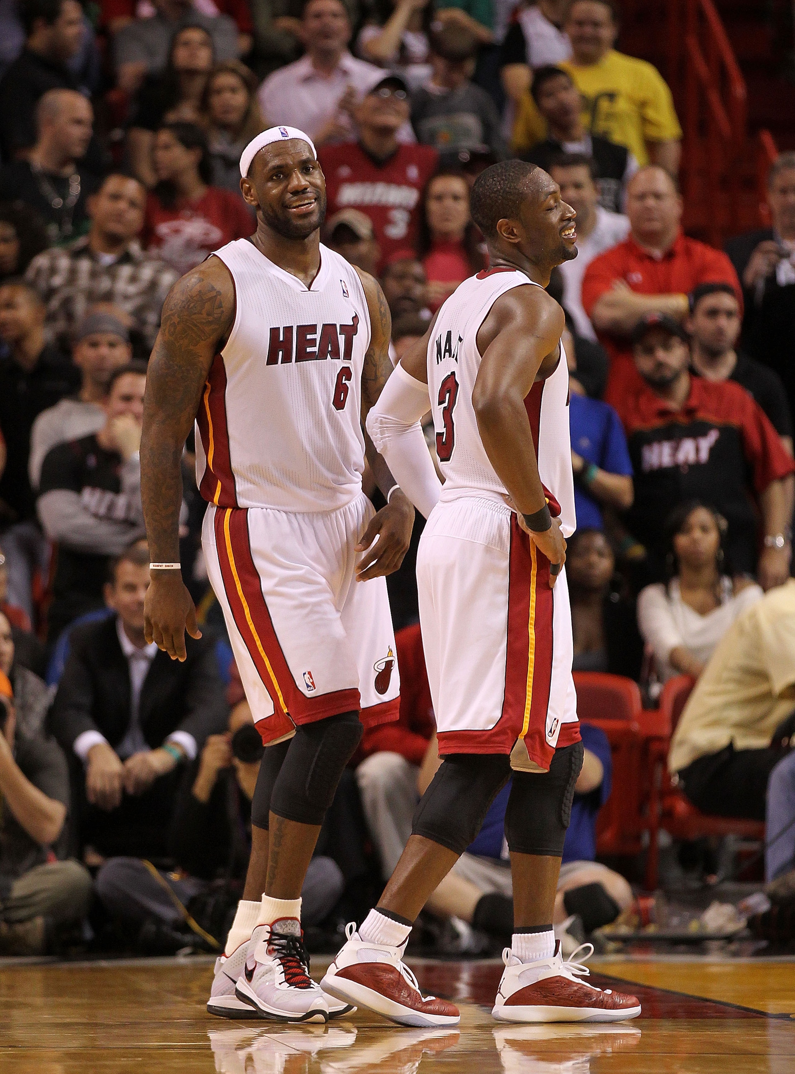 MIAMI, FL - FEBRUARY 08:  LeBron James #6 of the Miami Heat laughs with Dwyane Wade #3 during a game against the Indiana Pacers at American Airlines Arena on February 8, 2011 in Miami, Florida. NOTE TO USER: User expressly acknowledges and agrees that, by