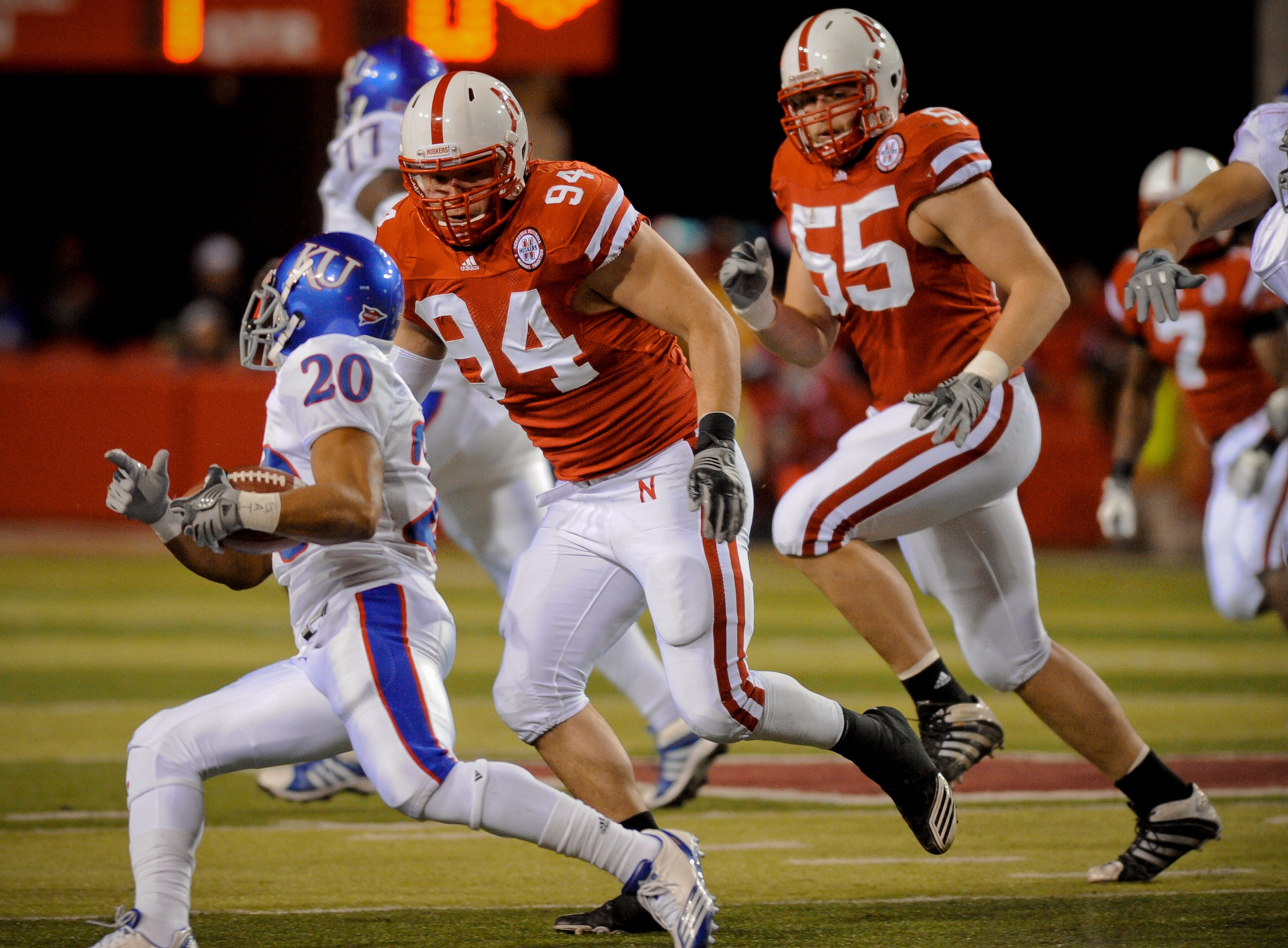 LINCOLN, NE - NOVEMBER 13: Jared Crick #94 and Baker Steinkuhler #55 of the Nebraska Cornhuskers run down D.J. Beshears #20 of the Kansas Jayhawks during first half action of their game at Memorial Stadium on November 13, 2010 in Lincoln, Nebraska. (Phot LINCOLN, NE - NOVEMBER 13: Jared Crick #94 and Baker Steinkuhler #55 of the Nebraska Cornhuskers run down D.J. Beshears #20 of the Kansas Jayhawks during first half action of their game at Memorial Stadium on November 13, 2010 in Lincoln, Nebraska. (Phot