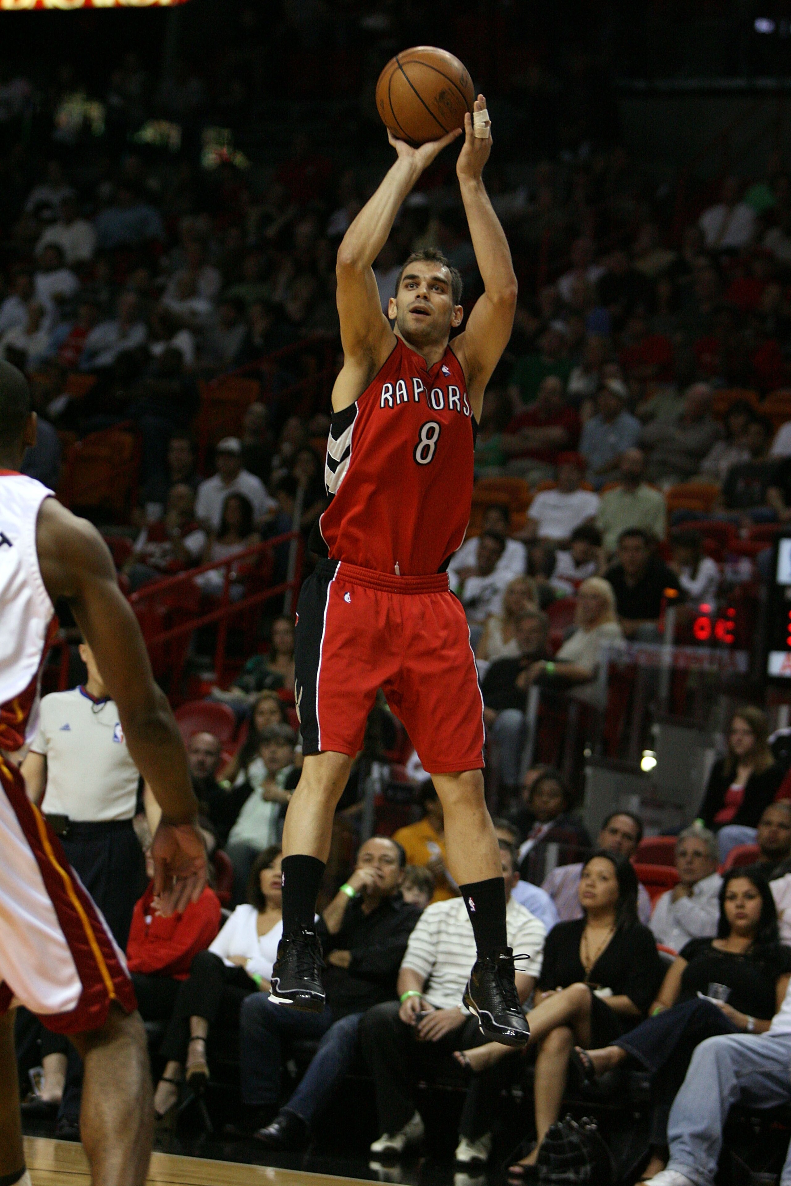 MIAMI - MARCH 05:  Jose Calderon #8 of the Toronto Raptors shoots against the Miami Heat at American Airlines Arena on March 5,  2008 in Miami, Florida.  NOTE TO USER: User expressly acknowledges and agrees that, by downloading and or using this photograp