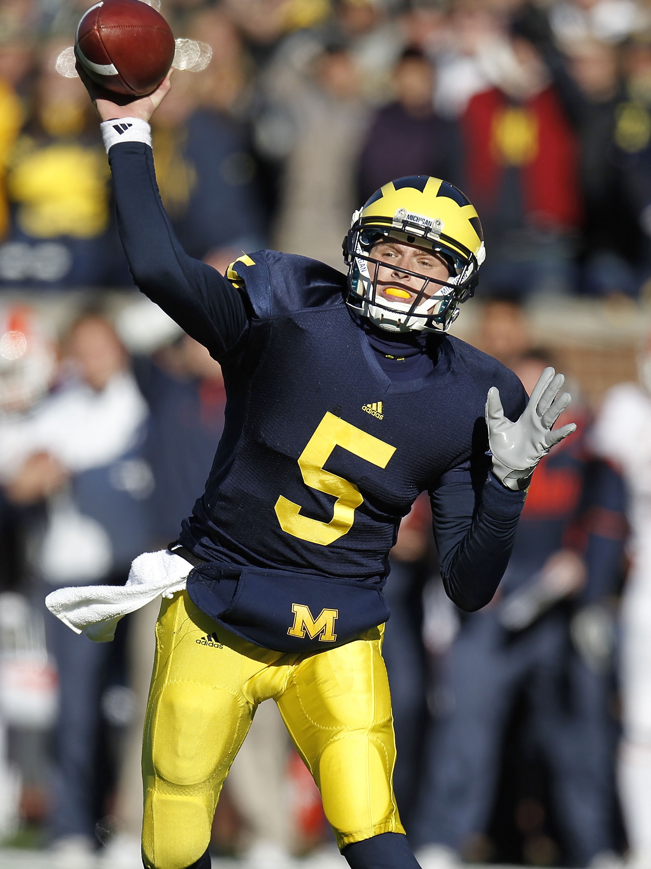 ANN ARBOR, MI - NOVEMBER 06:  Tate Forcier #5 of the Michigan Wolverines throws a fourth quarter pass while playing the Illinios Fighting Illini at Michigan Stadium on November 6, 2010 in Ann Arbor, Michigan. Michigan won the game 67-65. (Photo by Gregory