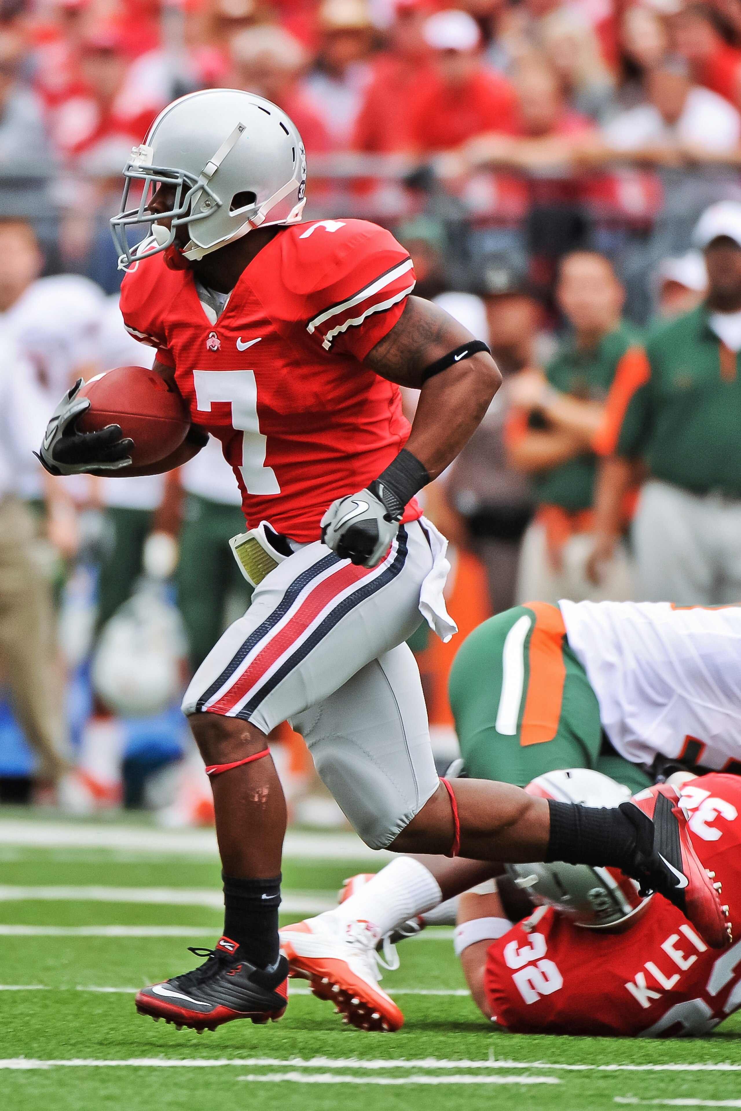COLUMBUS, OH - SEPTEMBER 11:  Jordan Hall #7 of the Ohio State Buckeyes runs back a kickoff against the Miami Hurricanes at Ohio Stadium on September 11, 2010 in Columbus, Ohio.  (Photo by Jamie Sabau/Getty Images)