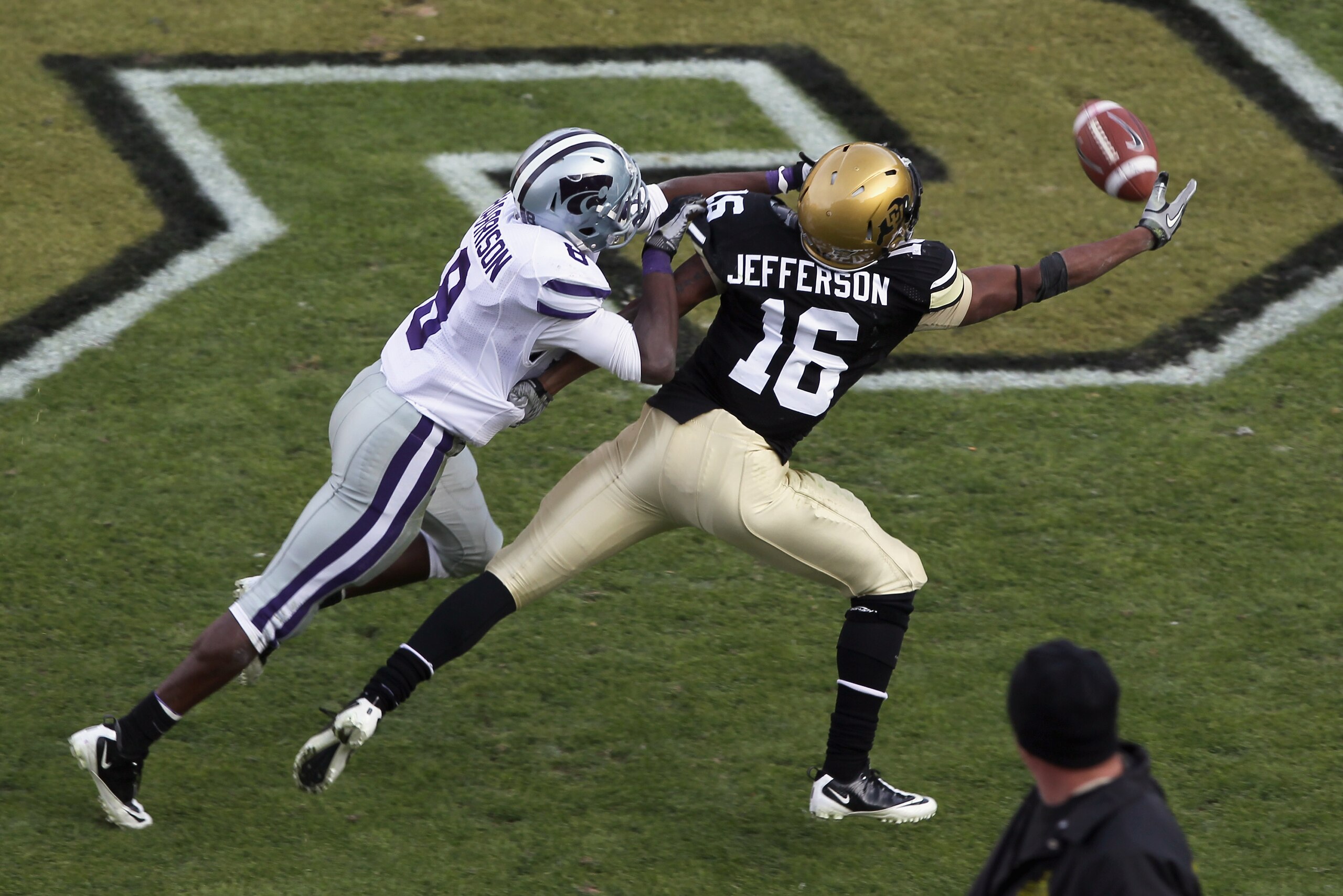 BOULDER, CO - NOVEMBER 20:  Defensive back Stephen Harrison #8 of the Kansas State Wildcats is called for pass interference as he defends against wide receiver Will Jefferson #16 of the Colorado Buffaloes in the endzone at Folsom Field on November 20, 201