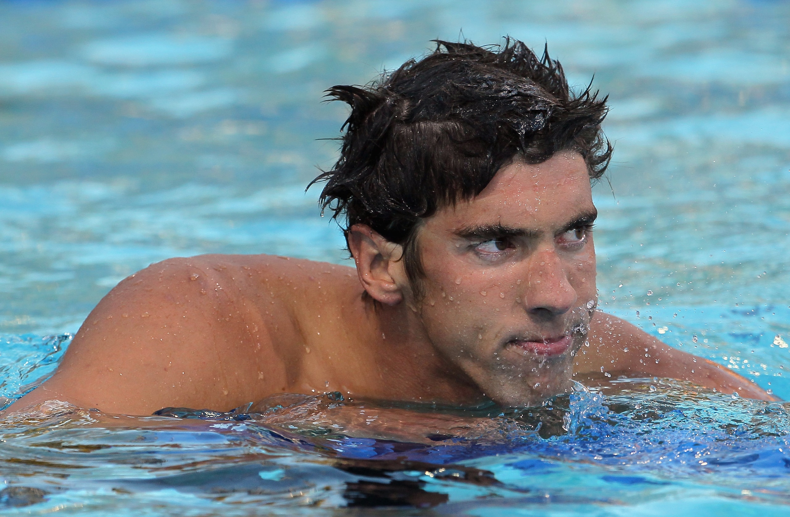 IRVINE, CA - AUGUST 20:  Michael Phelps looks on after swimming in the men's 100 meter butterfly final during the Mutual of Omaha Pan Pacific Championships at the William Woollett Jr. Aquatic Center on August 20, 2010 in Irvine, California.  (Photo by Jef