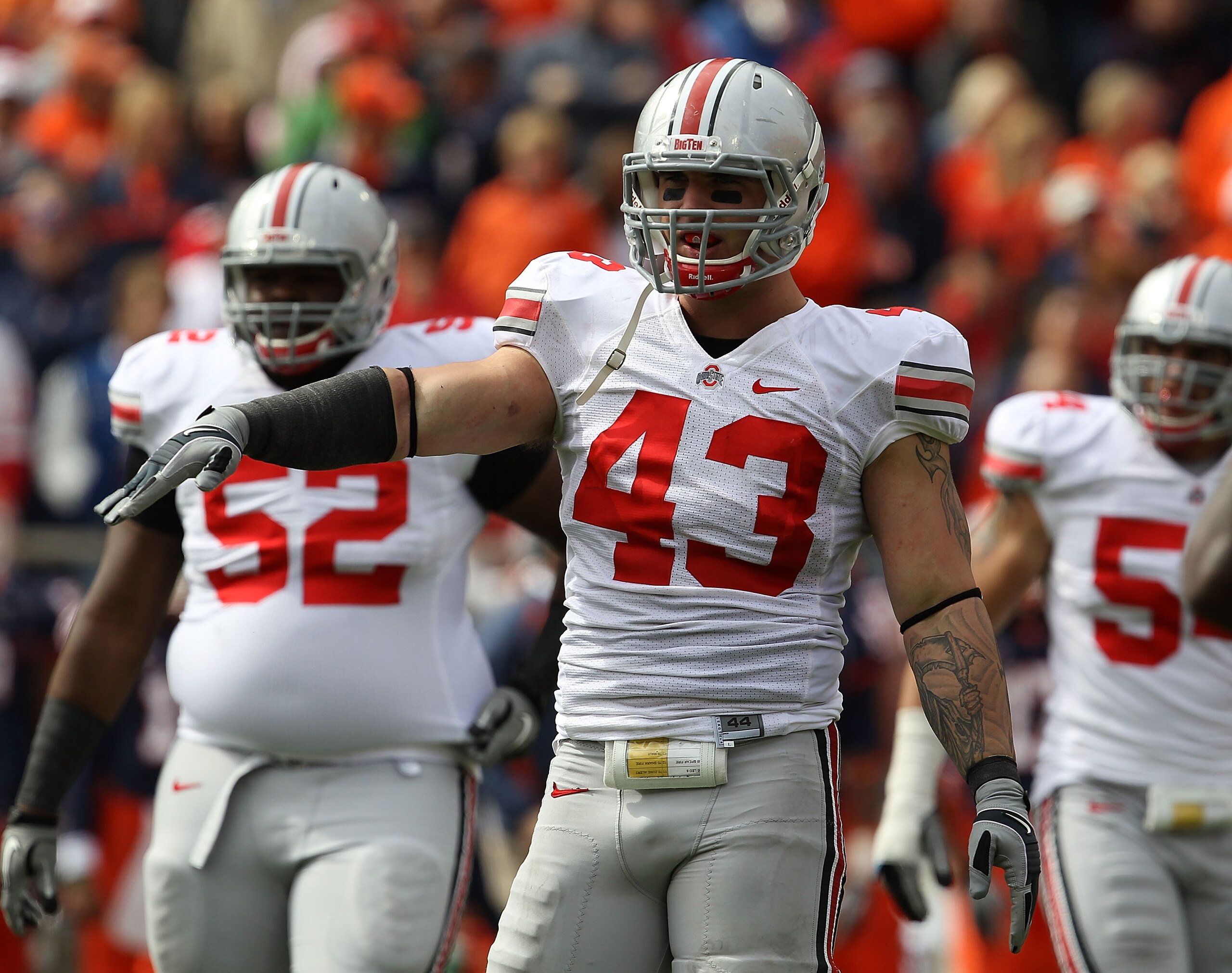 CHAMPAIGN, IL - OCTOBER 02: Nathan Williams #43 of the Ohio State Buckeyes salutes the bench after a sack against the Illinois Fighting Illini at Memorial Stadium on October 2, 2010 in Champaign, Illinois. Ohio State defeated Illinois 24-13. (Photo by Jon
