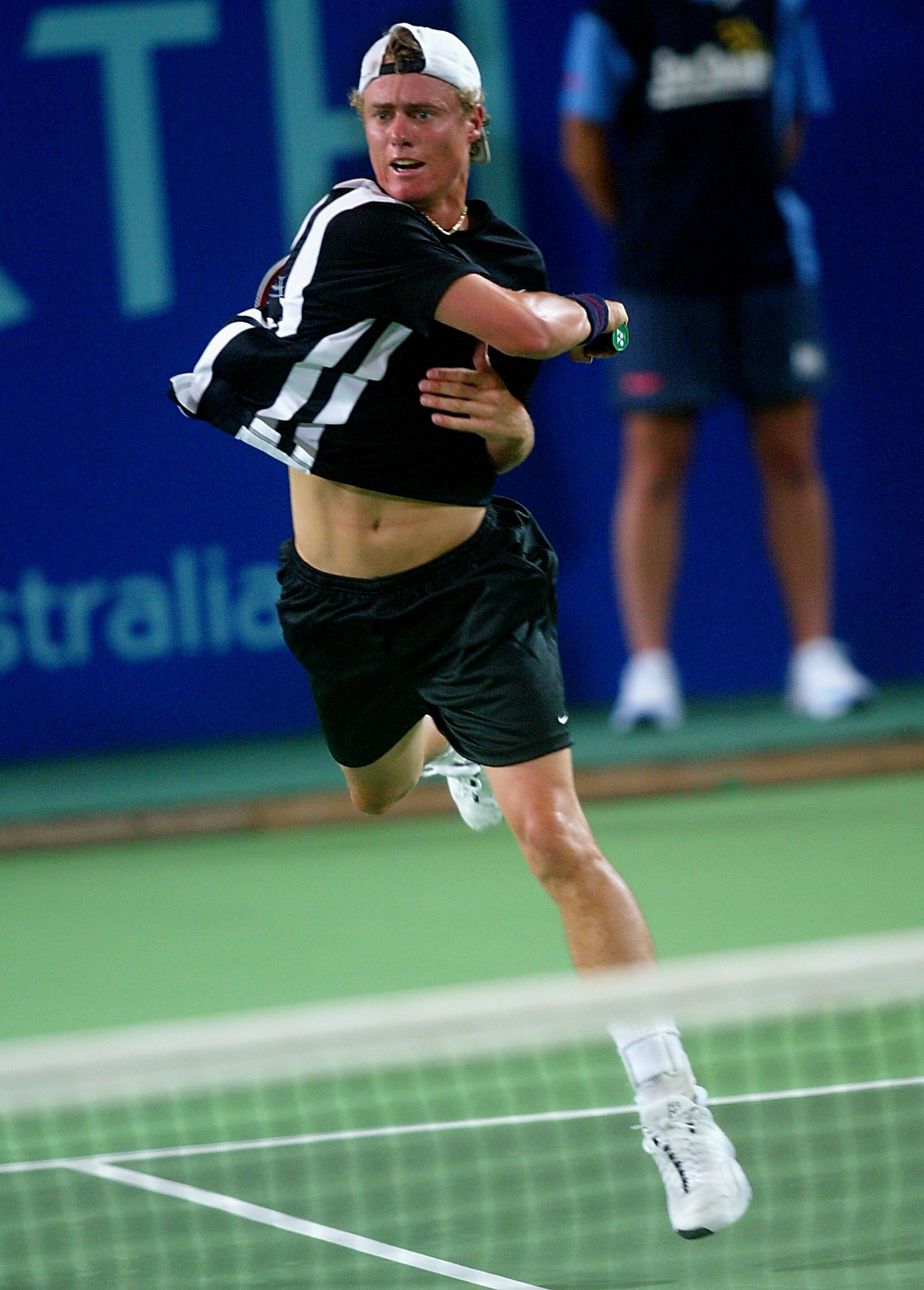 PERTH - DECEMBER 29:   Lleyton Hewitt of Australia in action against Davide Sanguinetti of Italy during the 2002/2003 Hyundai Hopman Cup at the Perth Superdome in Perth, Australia on December 29, 2002. (Photo by Sean Garnsworthy/Getty Images)