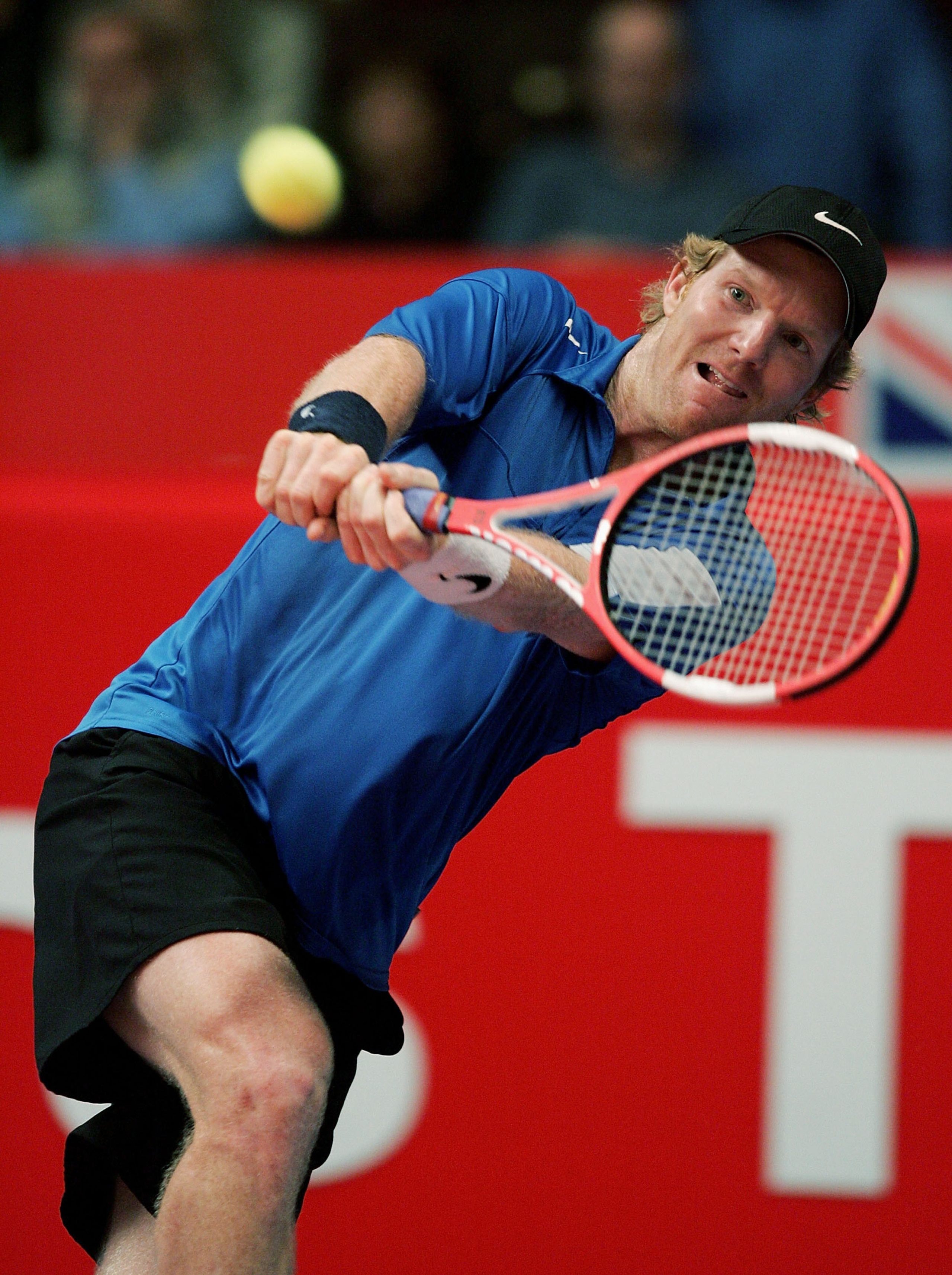 LONDON - DECEMBER 3:  Jim Courier of the USA plays a back hand during his match against Guy Forget of France at The Masters Tennis tournament at the Royal Albert Hall on December 3, 2004 in London, England.  (Photo by Julian Finney/Getty Images)
