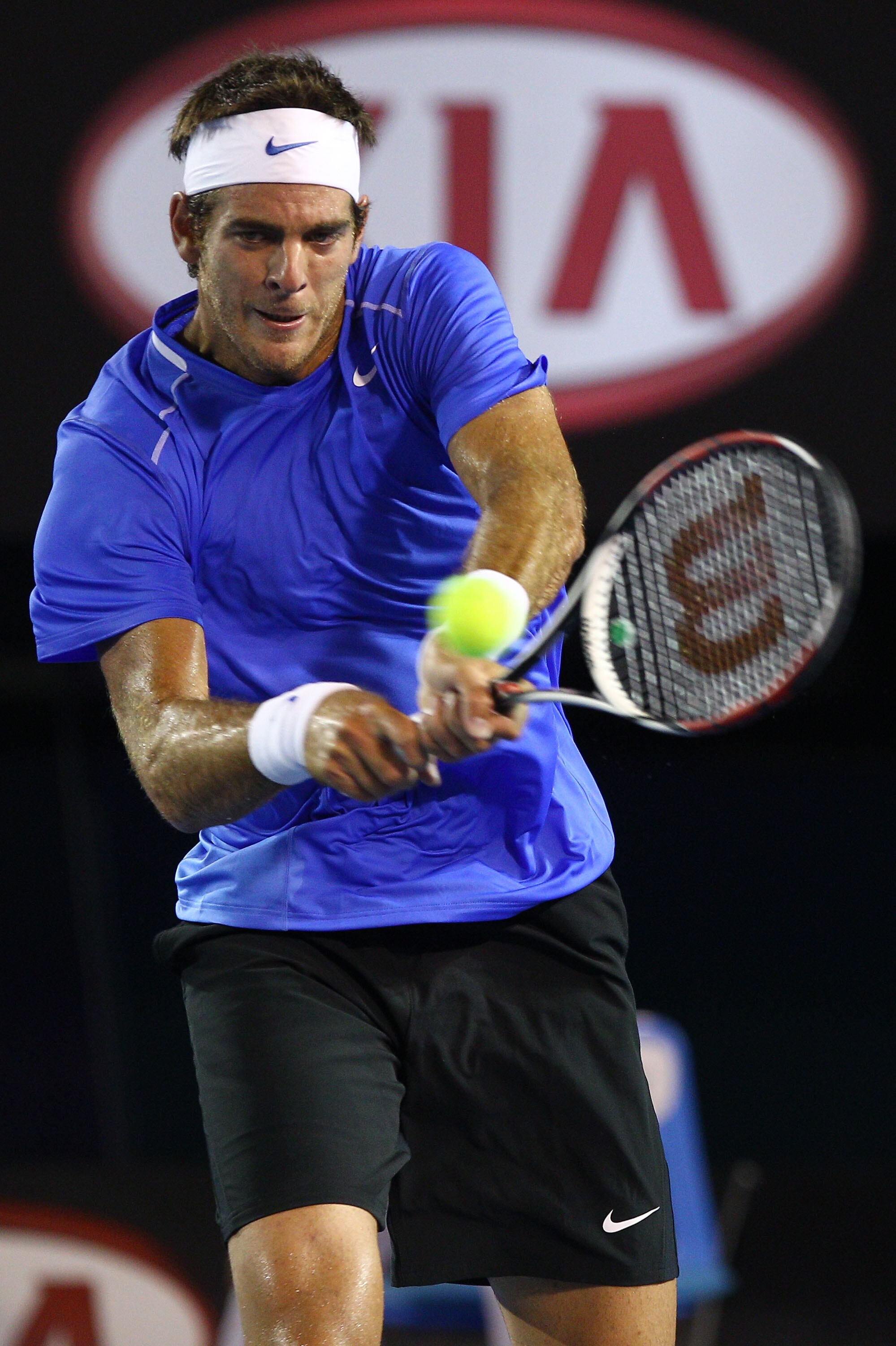 MELBOURNE, AUSTRALIA - JANUARY 20:  Juan Martin Del Potro of Argentina plays a backhand in his second round match against Marcos Baghdatis of Cyprus during day four of the 2011 Australian Open at Melbourne Park on January 20, 2011 in Melbourne, Australia.