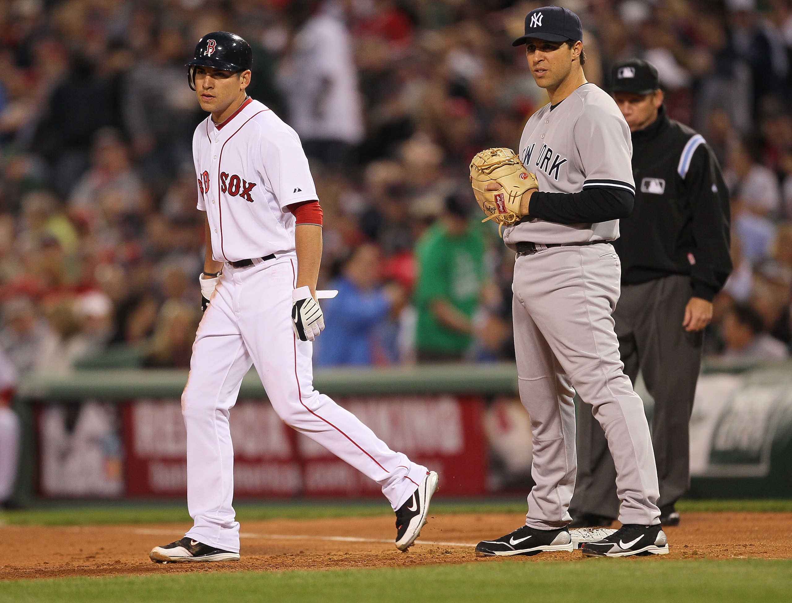BOSTON - APRIL 06:  Jacoby Ellsbury #2 leads away from Mark Teixeira #25 of the New York Yankees at Fenway Park on April 6, 2010 in Boston, Massachusetts. (Photo by Jim Rogash/Getty Images)