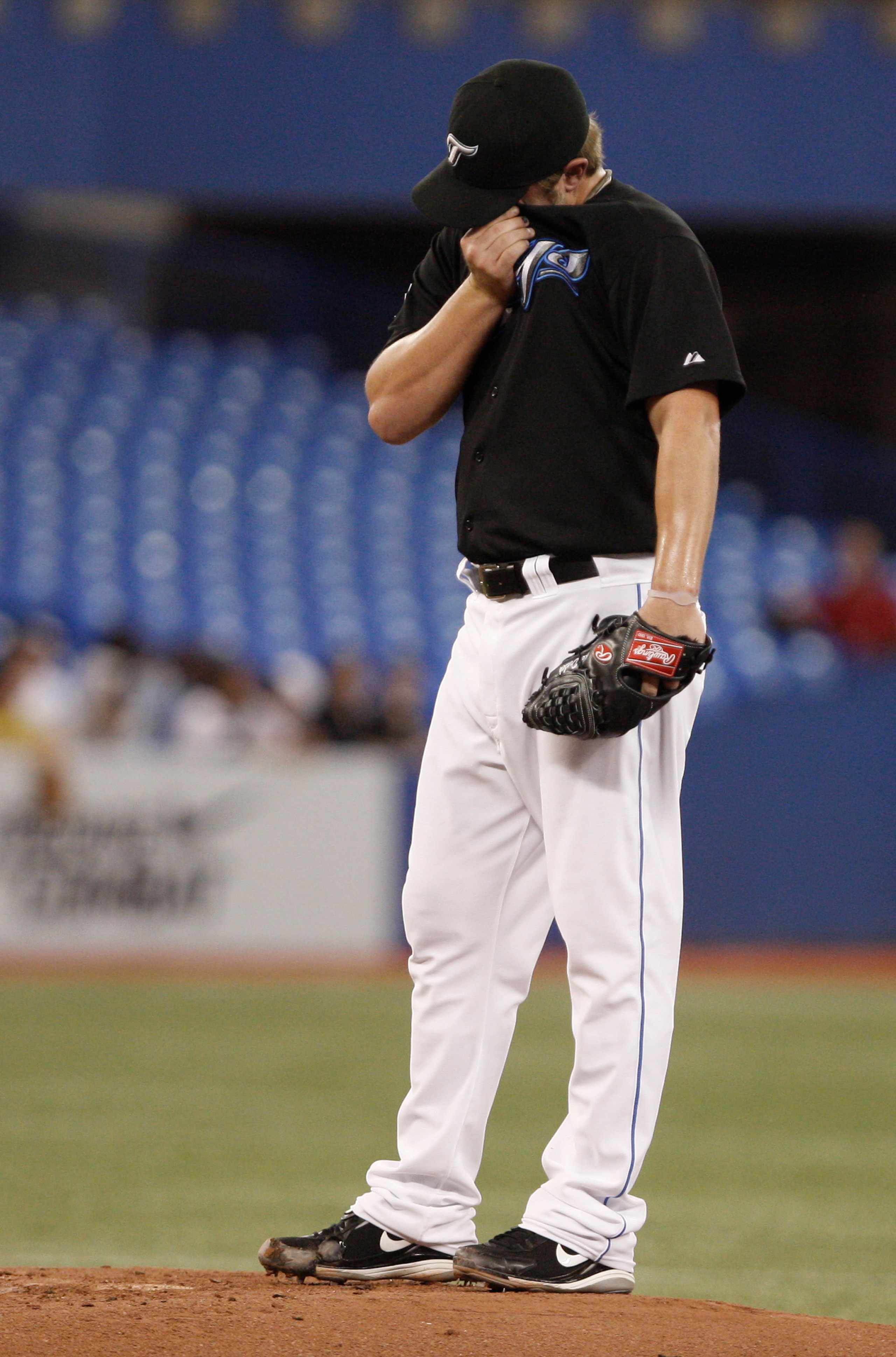 TORONTO, ON - SEPTEMBER 28: Kyle Drabek #4 of the Toronto Blue Jays regroups after a run scores against the New York Yankees during an MLB game at the Rogers Centre September 28, 2010 in Toronto, Ontario, Canada. (Photo by Abelimages/Getty Images)