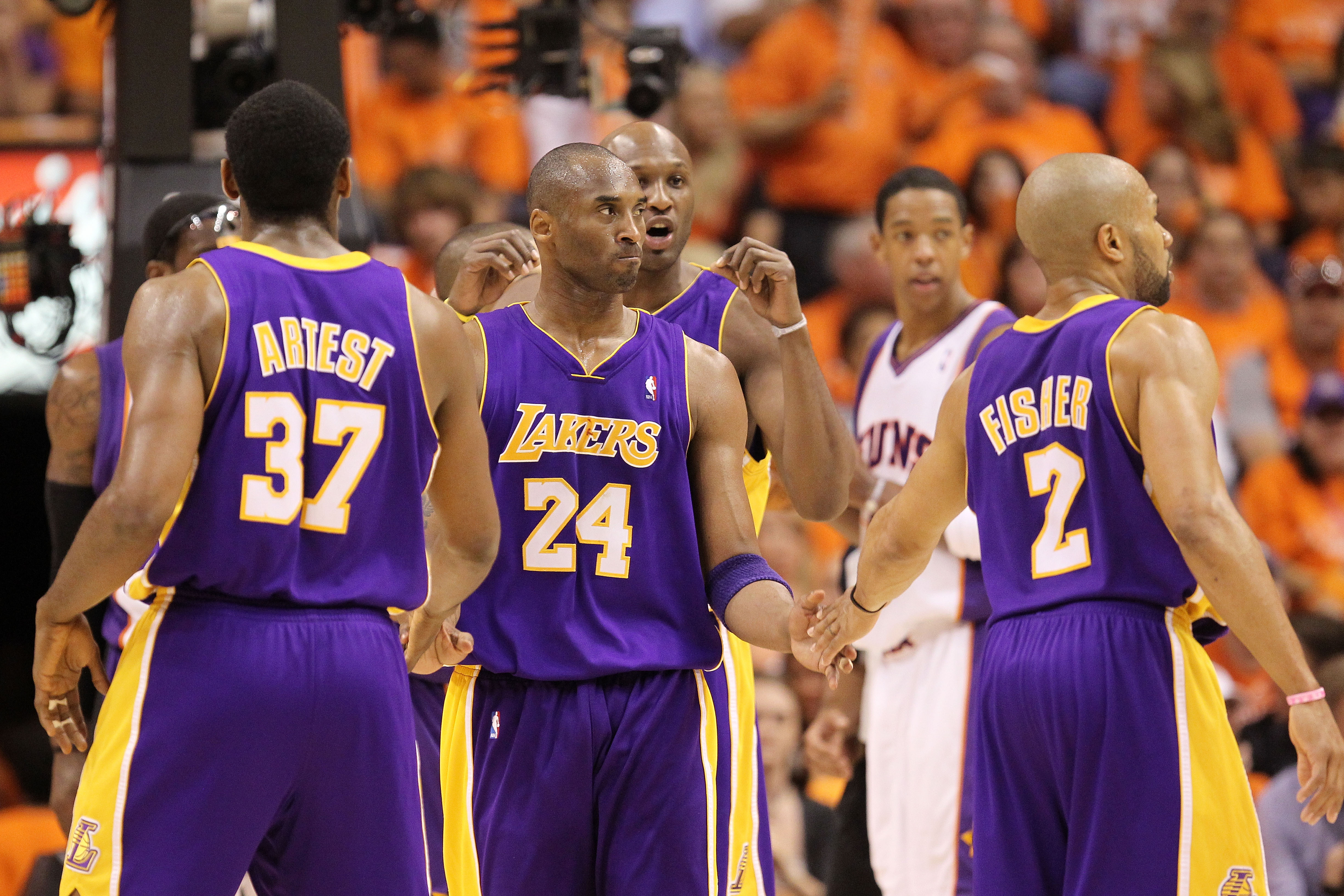 PHOENIX - MAY 29:  Ron Artest #37, Kobe Bryant #24, Lamar Odom #7 and Derek Fisher #2 of the Los Angeles Lakers celebrate a play against the Phoenix Suns in the third quarter of Game Six of the Western Conference Finals during the 2010 NBA Playoffs at US