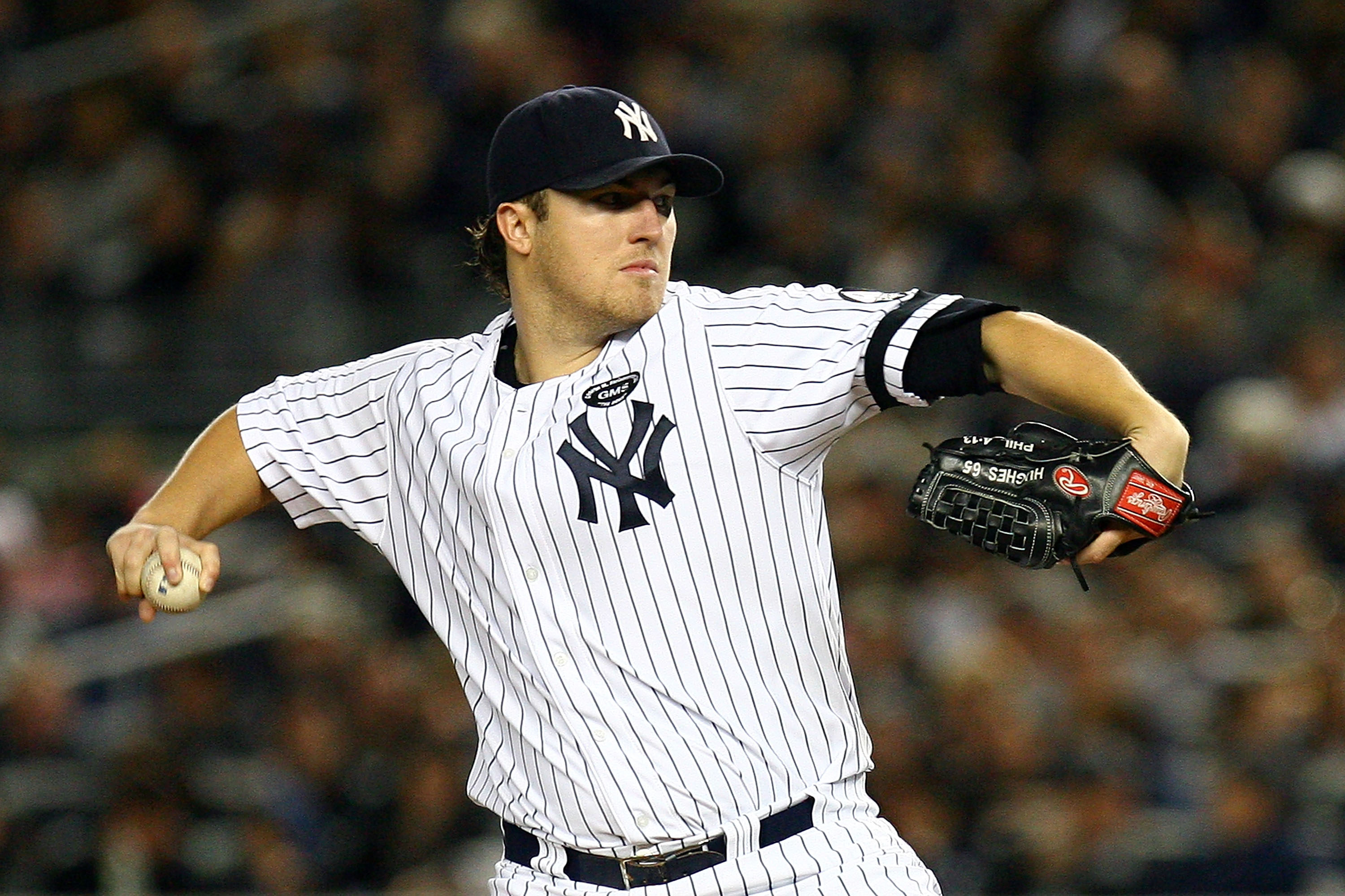 NEW YORK - OCTOBER 09:  Starting pitcher Phil Hughes #65 of the New York Yankees throws a pitch in the first inning against the Minnesota Twins during Game Three of the ALDS part of the 2010 MLB Playoffs at Yankee Stadium on October 9, 2010 in the Bronx b