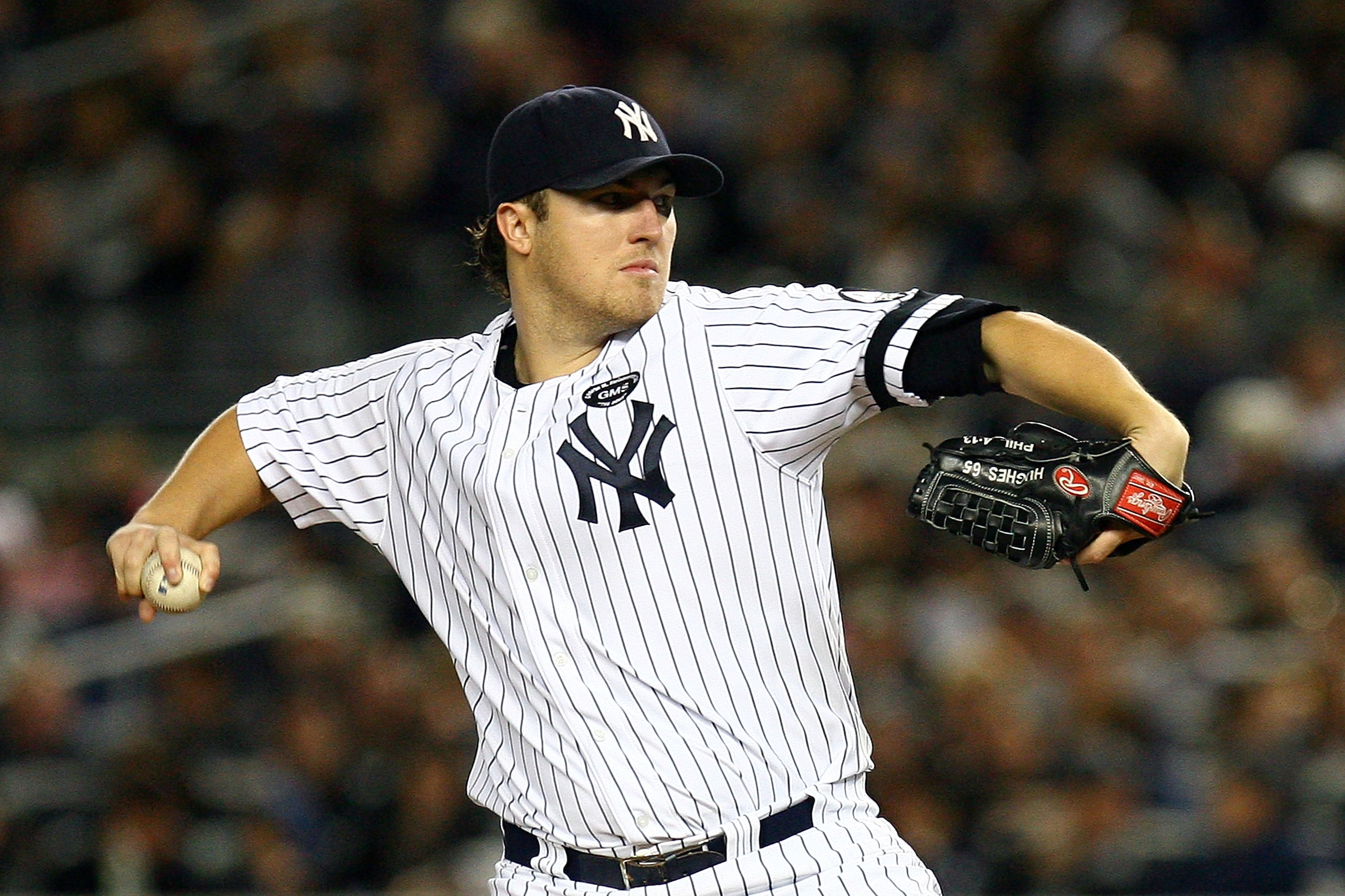 NEW YORK - OCTOBER 09:  Starting pitcher Phil Hughes #65 of the New York Yankees throws a pitch in the first inning against the Minnesota Twins during Game Three of the ALDS part of the 2010 MLB Playoffs at Yankee Stadium on October 9, 2010 in the Bronx b