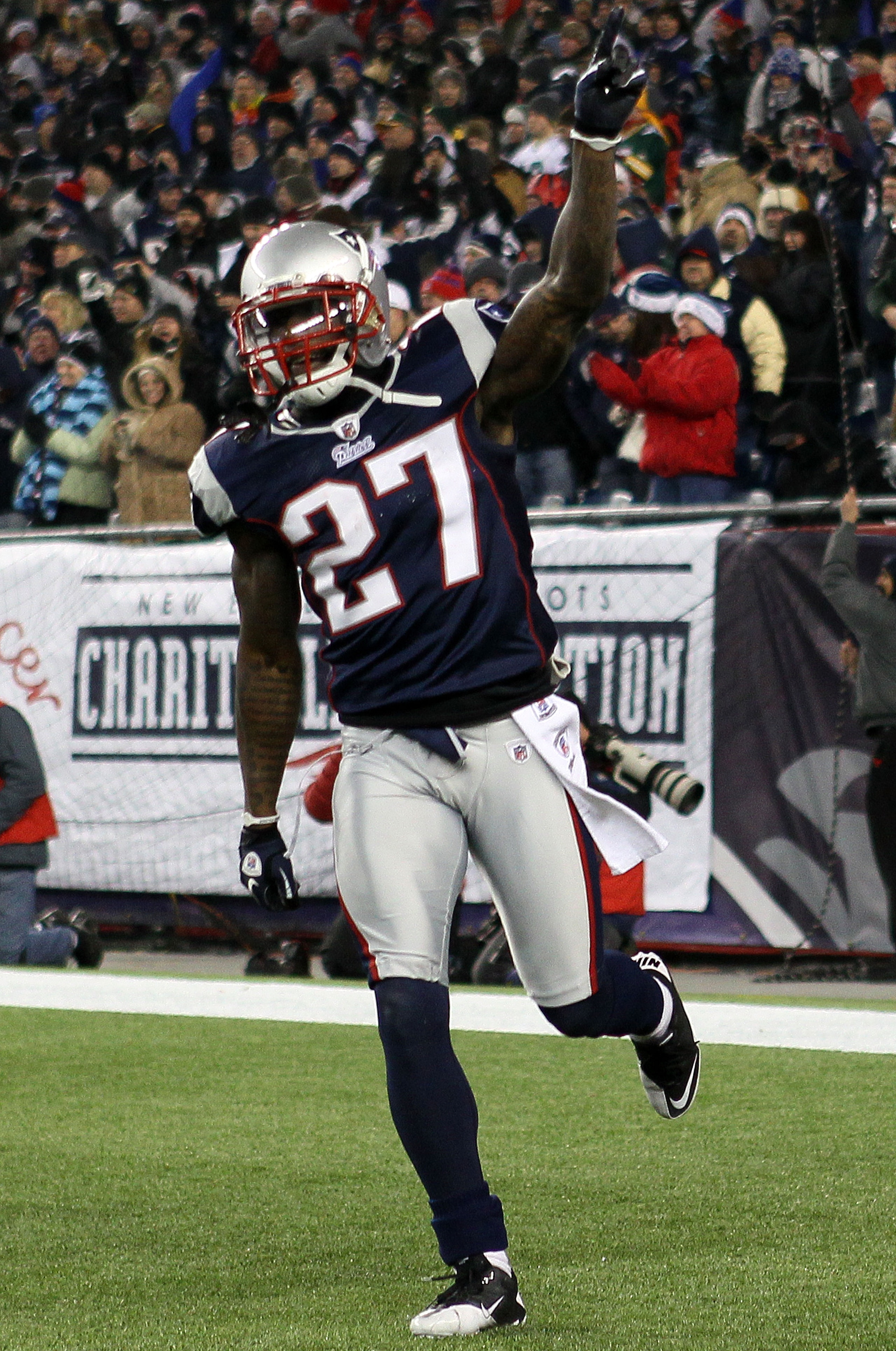 FOXBORO, MA - DECEMBER 19: Cornerback Kyle Arrington #27 of the New England Patriots celebrates scoring a touchdown after intercepting the ball and running 36 yards against the Green Bay Packers during the third quarter of the game at Gillette Stadium on FOXBORO, MA - DECEMBER 19: Cornerback Kyle Arrington #27 of the New England Patriots celebrates scoring a touchdown after intercepting the ball and running 36 yards against the Green Bay Packers during the third quarter of the game at Gillette Stadium on
