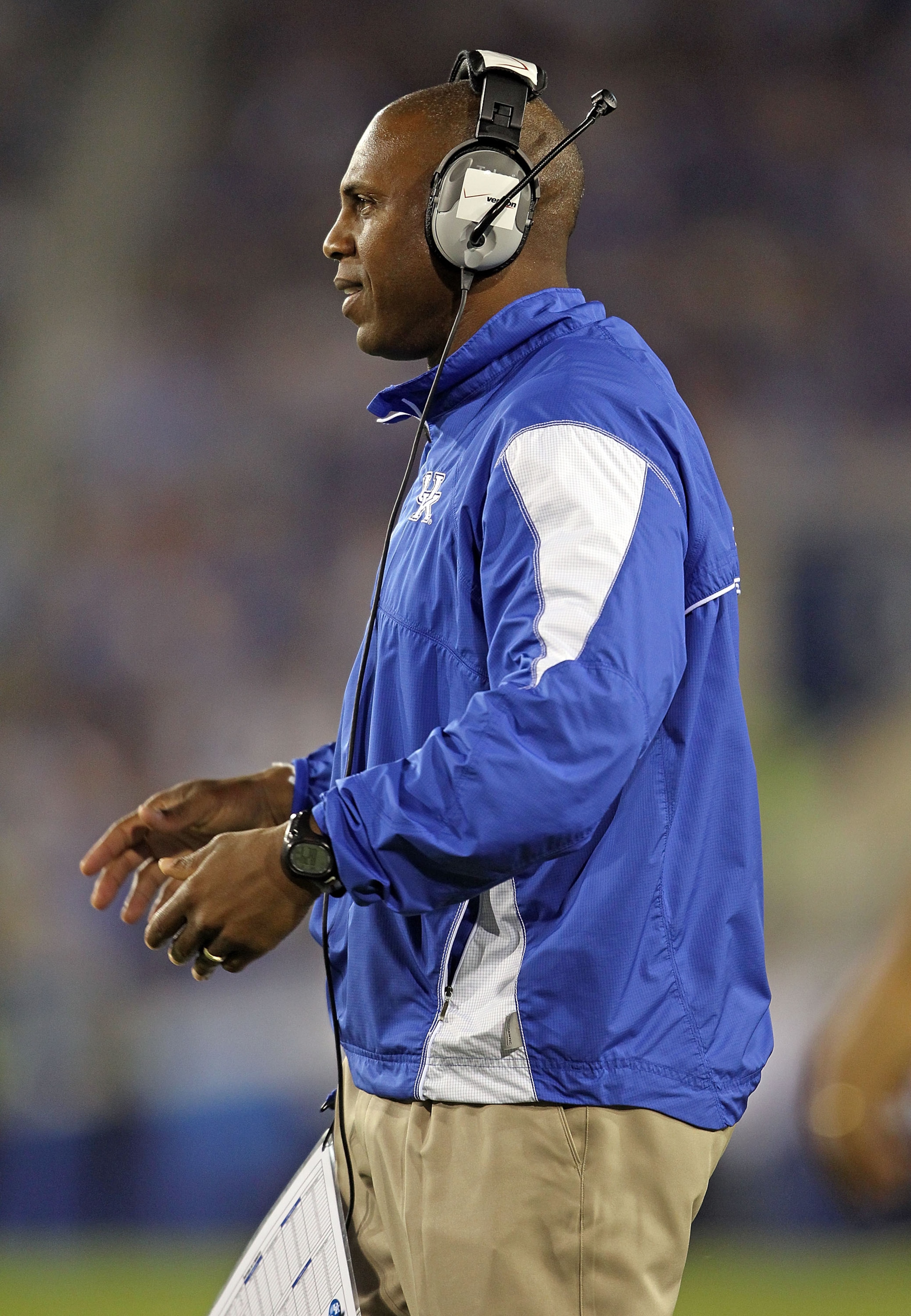 LEXINGTON, KY - SEPTEMBER 18: Joker Phillips the Head Coach of the Kentucky Wildcats gives instructions to his team during the game against the Akron Zips at Commonwealth Stadium on September 18, 2010 in Lexington, Kentucky.  (Photo by Andy Lyons/Getty Im