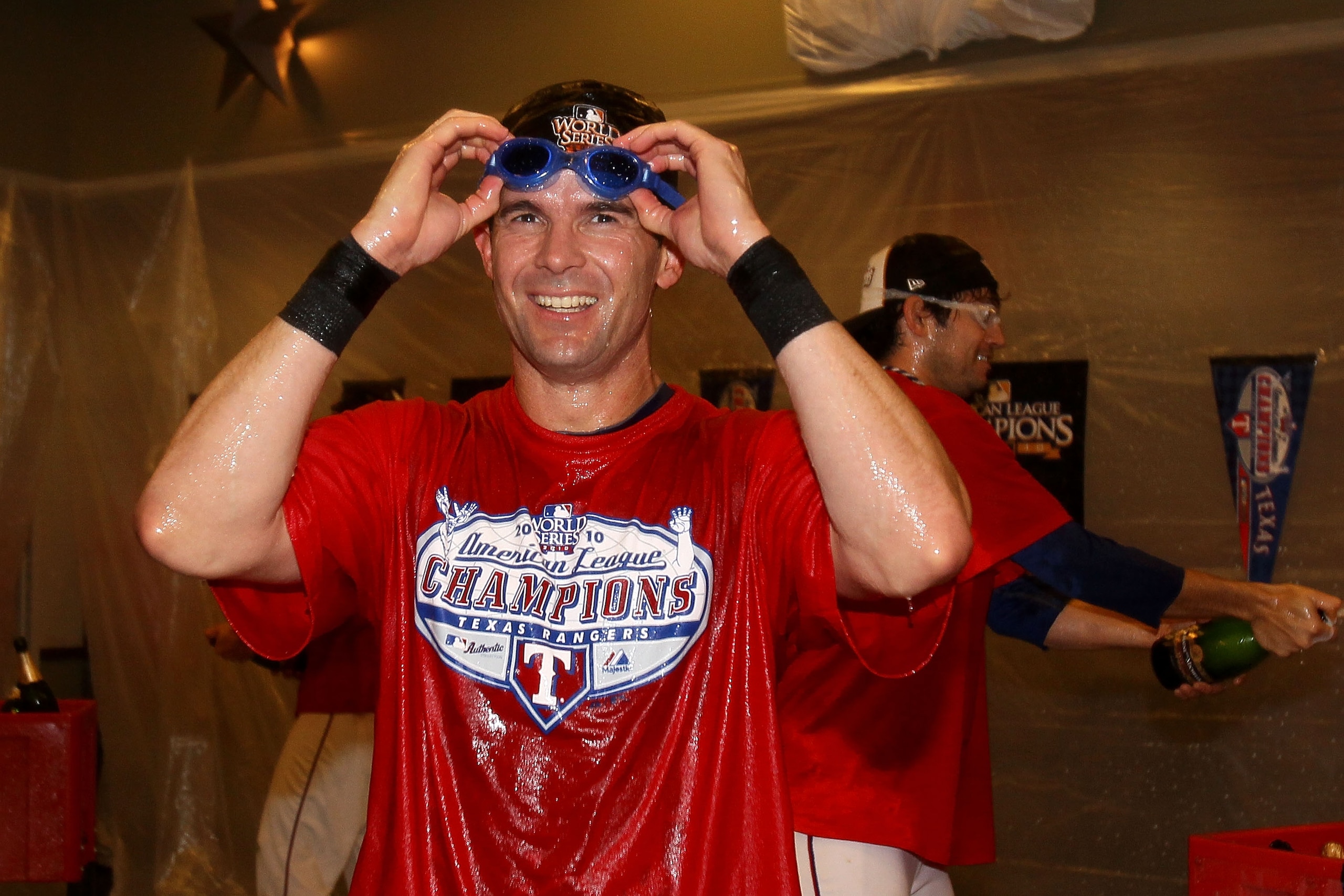 ARLINGTON, TX - OCTOBER 22: Michael Young #10 of the Texas Rangers celebrates in the lockerroom after defeating the New York Yankees 6-1 in Game Six of the ALCS to advance to the World Series during the 2010 MLB Playoffs at Rangers Ballpark in Arlington ARLINGTON, TX - OCTOBER 22: Michael Young #10 of the Texas Rangers celebrates in the lockerroom after defeating the New York Yankees 6-1 in Game Six of the ALCS to advance to the World Series during the 2010 MLB Playoffs at Rangers Ballpark in Arlington