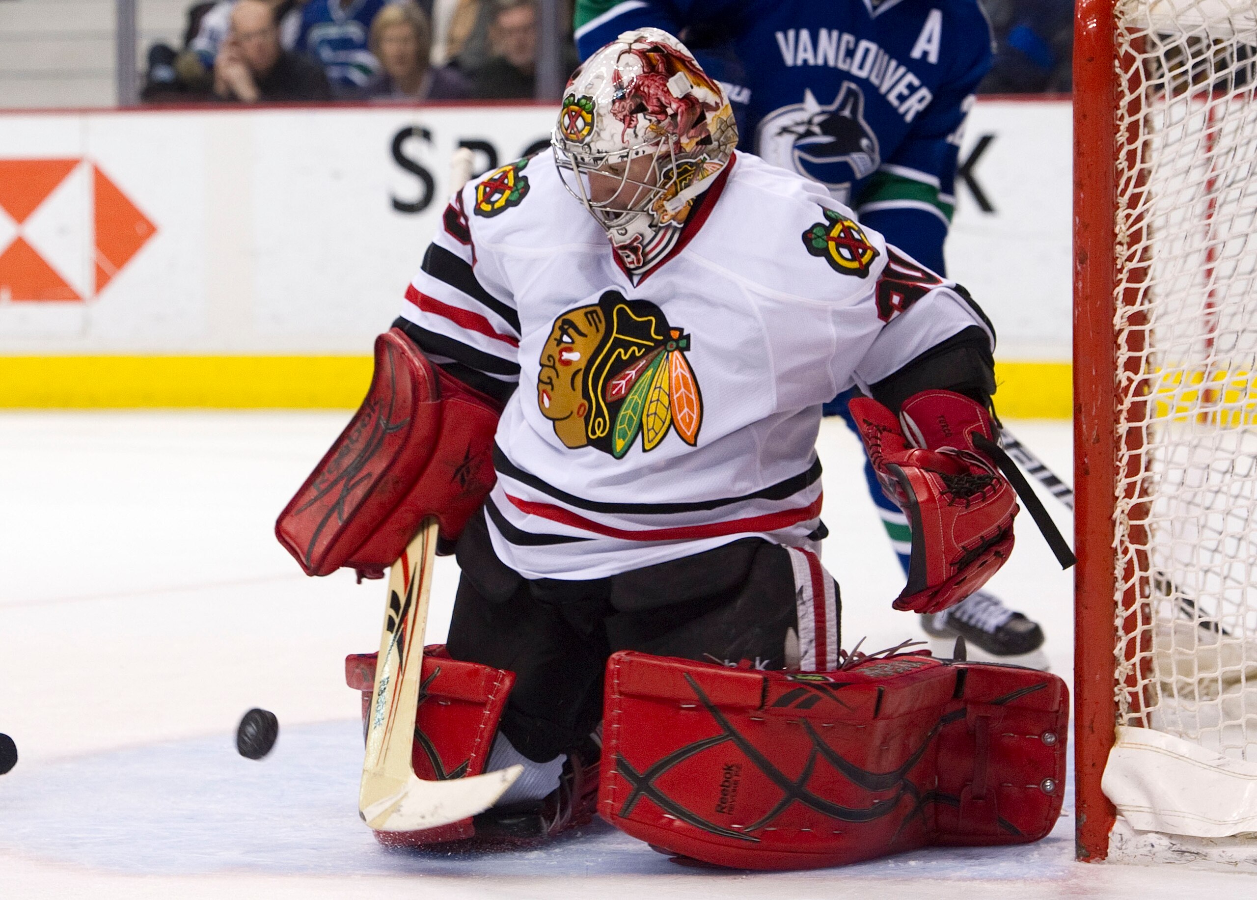 VANCOUVER, CANADA - FEBRUARY 4: Goalie Marty Turco #30 of the Chicago Blackhawks makes a pad save against the Vancouver Canucks during the second period in NHL action on February 04, 2011 at Rogers Arena in Vancouver, British Columbia, Canada. (Photo by R