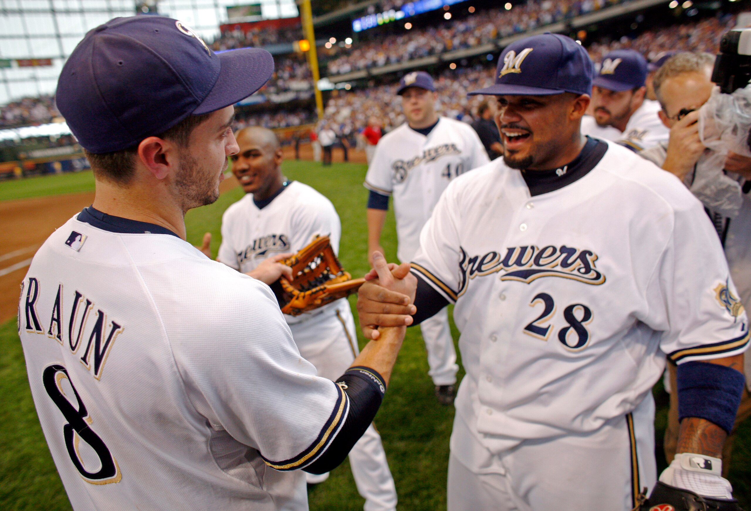 MILWAUKEE - SEPTEMBER 28:  Prince Fielder #28 of the Milwaukee Brewers congratulates teammate Ryan Braun #8 as they celebrate clinching the National League Wild Card after the game against the Chicago Cubs at Miller Park on September 28, 2008 in Milwaukee