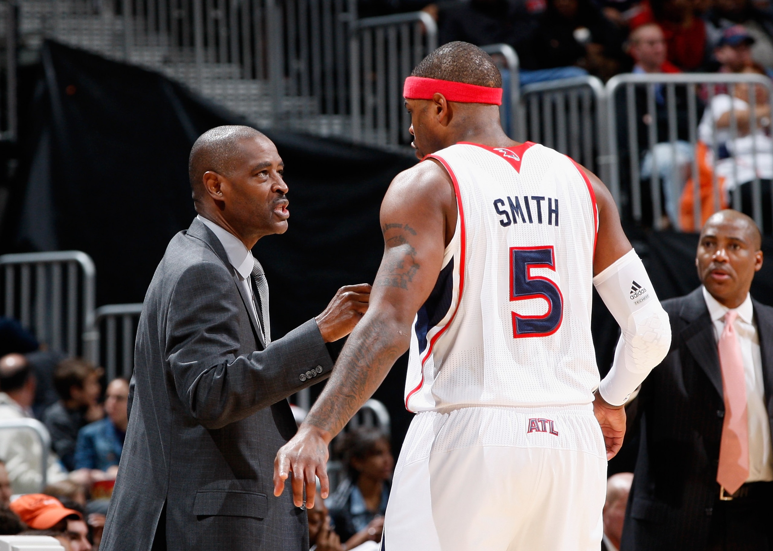 ATLANTA, GA - DECEMBER 11:  Head coach Larry Drew and Josh Smith #5 of the Atlanta Hawks against the Indiana Pacers at Philips Arena on December 11, 2010 in Atlanta, Georgia.  NOTE TO USER: User expressly acknowledges and agrees that, by downloading and/o