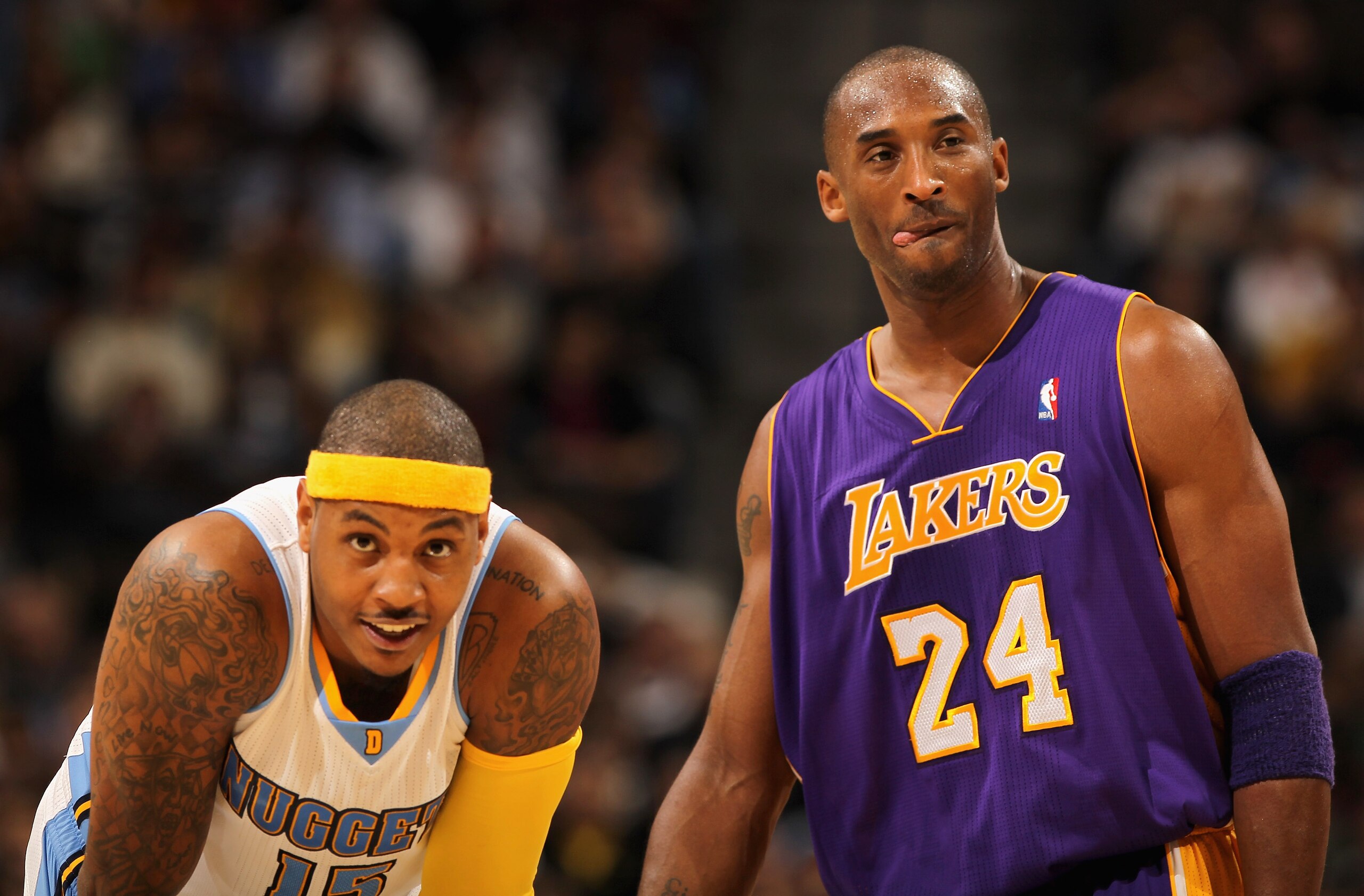DENVER - NOVEMBER 11: Kobe Bryant #24 of the Los Angeles Lakers and Carmelo Anthony #15 of the Denver Nuggets look on during a break in the action at the Pepsi Center on November 11, 2010 in Denver, Colorado. The Nuggets defeated the Lakers 118-112. NOT DENVER - NOVEMBER 11: Kobe Bryant #24 of the Los Angeles Lakers and Carmelo Anthony #15 of the Denver Nuggets look on during a break in the action at the Pepsi Center on November 11, 2010 in Denver, Colorado. The Nuggets defeated the Lakers 118-112. NOT